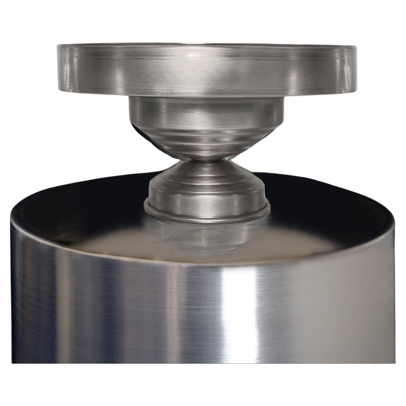 Set of 2 - Handcrafted in Italy, this silver-plated brass centerpiece pedestal combines minimalist aesthetics with timeless craftsmanship. Designed by Federica Paoli, it features a sculptural geometric form that reflects the brilliance of the