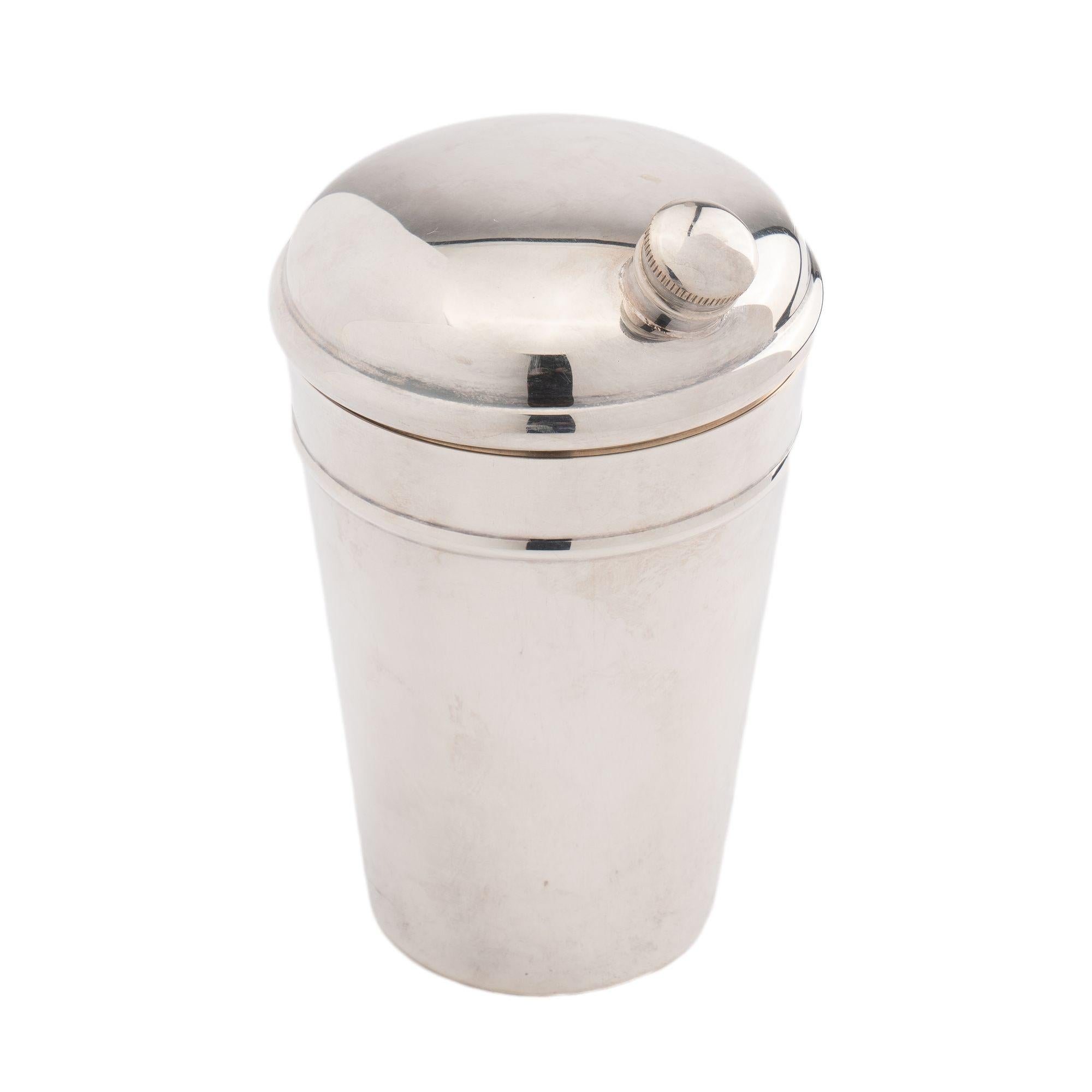 Tapered cylinder shape silver plated cocktail shaker with threaded pouring spout on a pressure fitted removable domed lid.
Stamped on the underside: Gorham, YC43

American, mid 20th century.