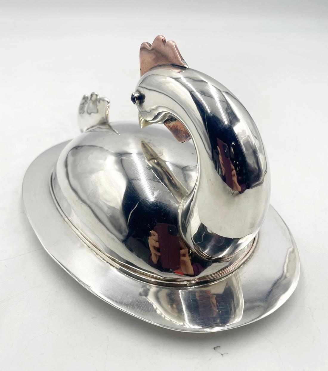 Introducing the exquisite Silver Plated, Copper & Brass Butter Dish by renowned artist Emilia Castillo, a true masterpiece of Mexico Modernism. This captivating piece showcases the perfect blend of elegance and functionality, meticulously