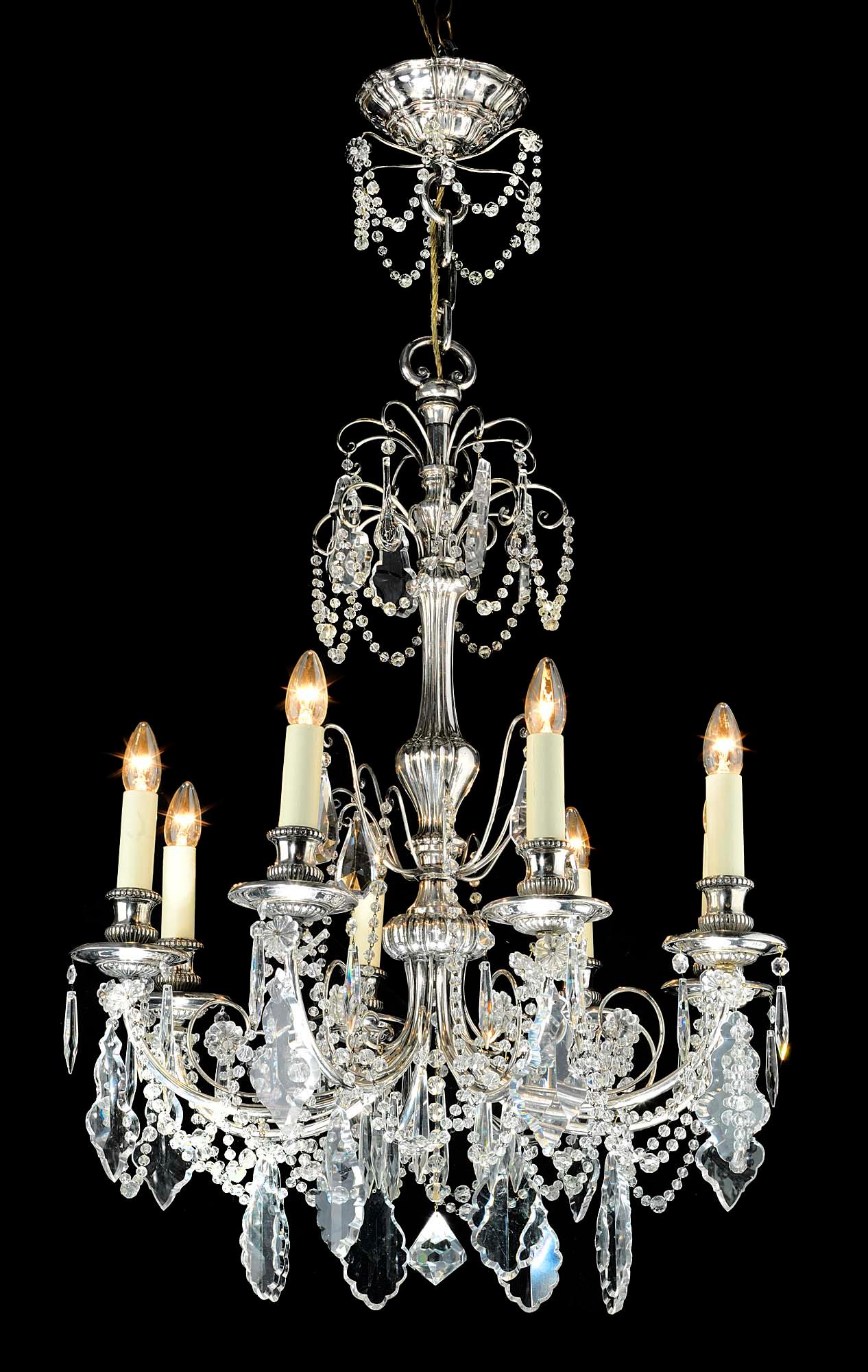 A fine silver plated (unusually thick silver plate on copper) eight-light, crystal chandelier with the original gadrooned ceiling rose, in the neoclassical manner,
early 20th century.