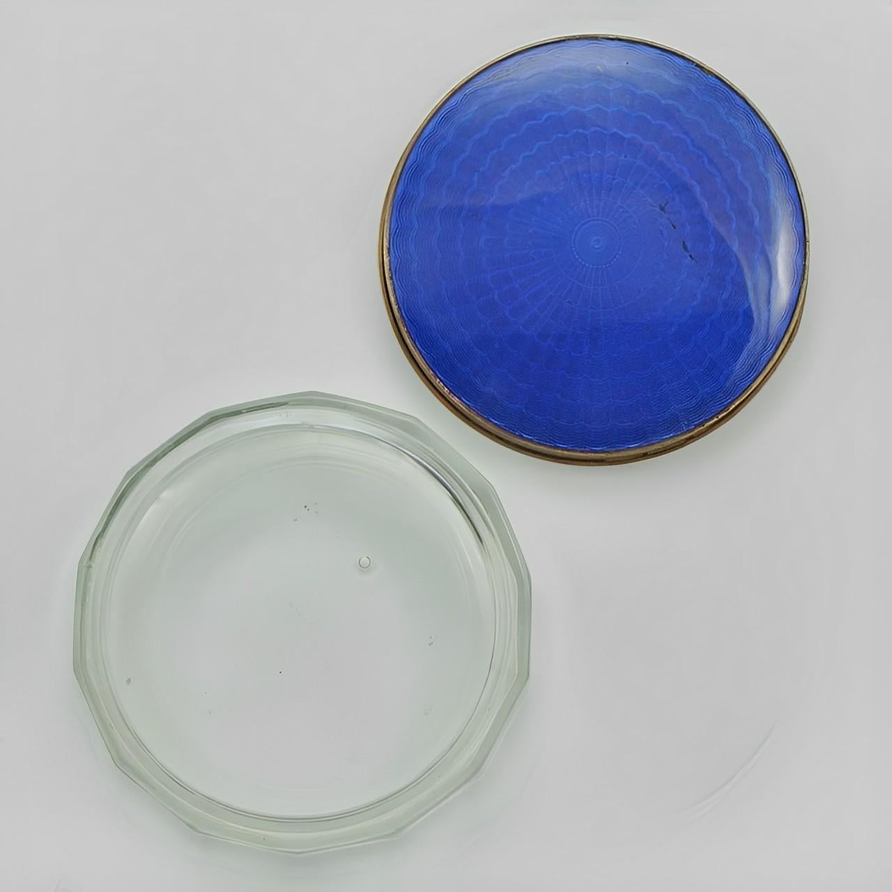 Beautiful silver plated electric blue guilloche enamel glass jar. The lid measures diameter 8.6 cm / 3.38 inches and the base is diameter 9.1 cm / 3.58 inches. Height is 3cm / 1.18 inches. There is a chip to the bottom of the glass, and a very small