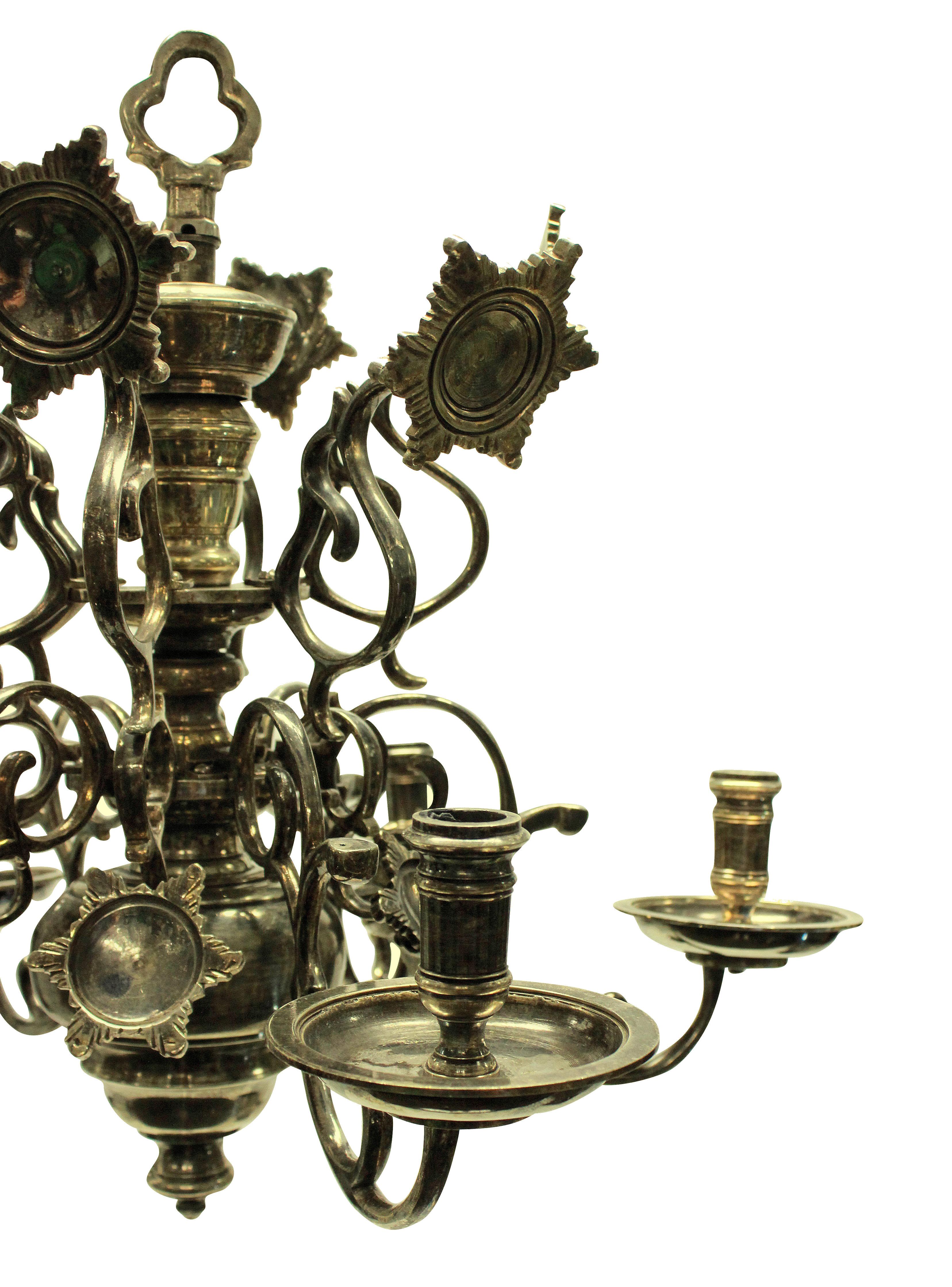 A Flemish silver plated brass chandelier, with reflectors and individually numbered arms.
