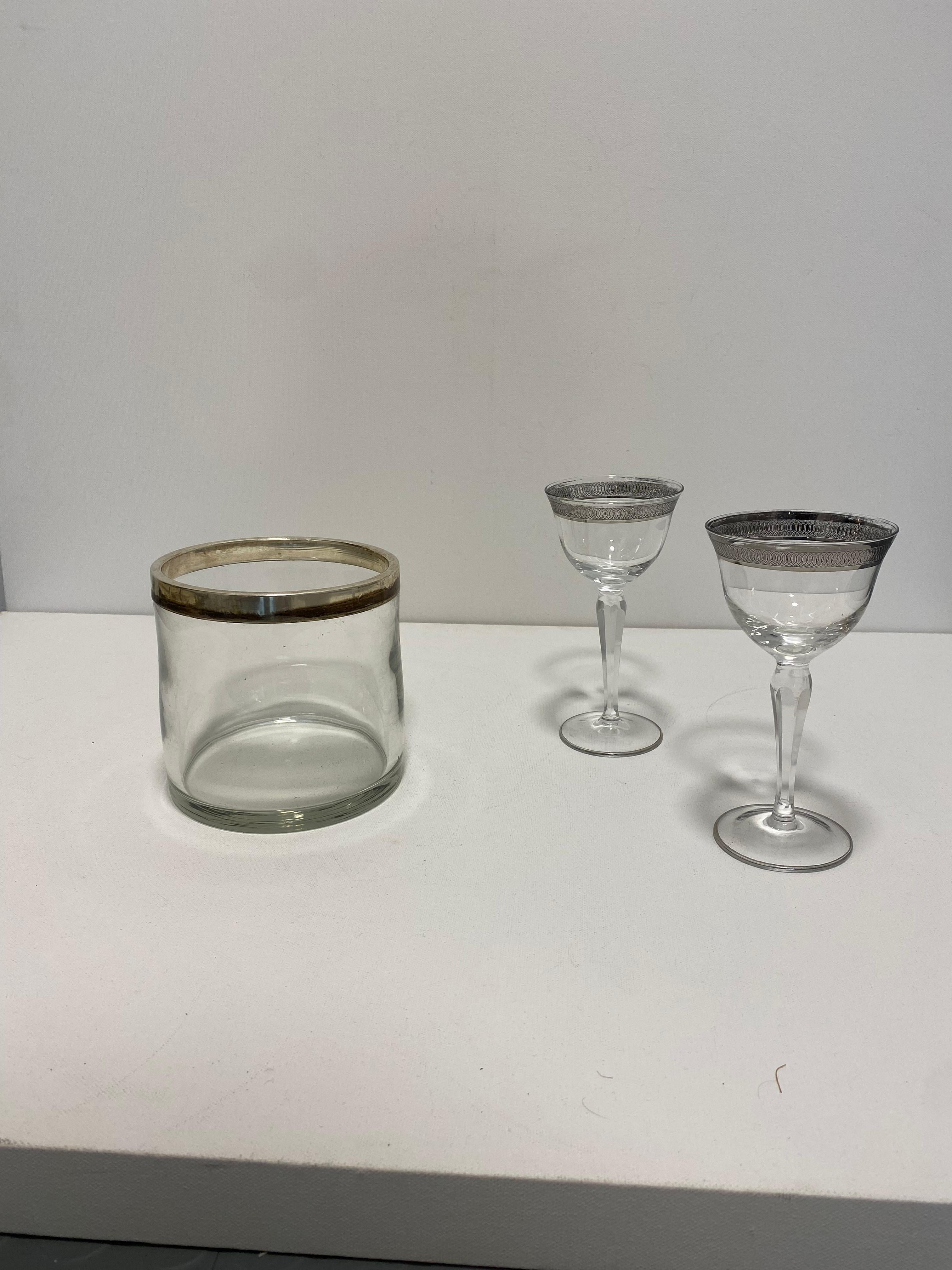 Simple but elegant ice bucket in glass body and silver plated trim reminiscent of the art deco period. 

The ice bucket or bottle cooler is a fine example of midcentury Italian design, simple but elegant reminiscent of the art deco period and