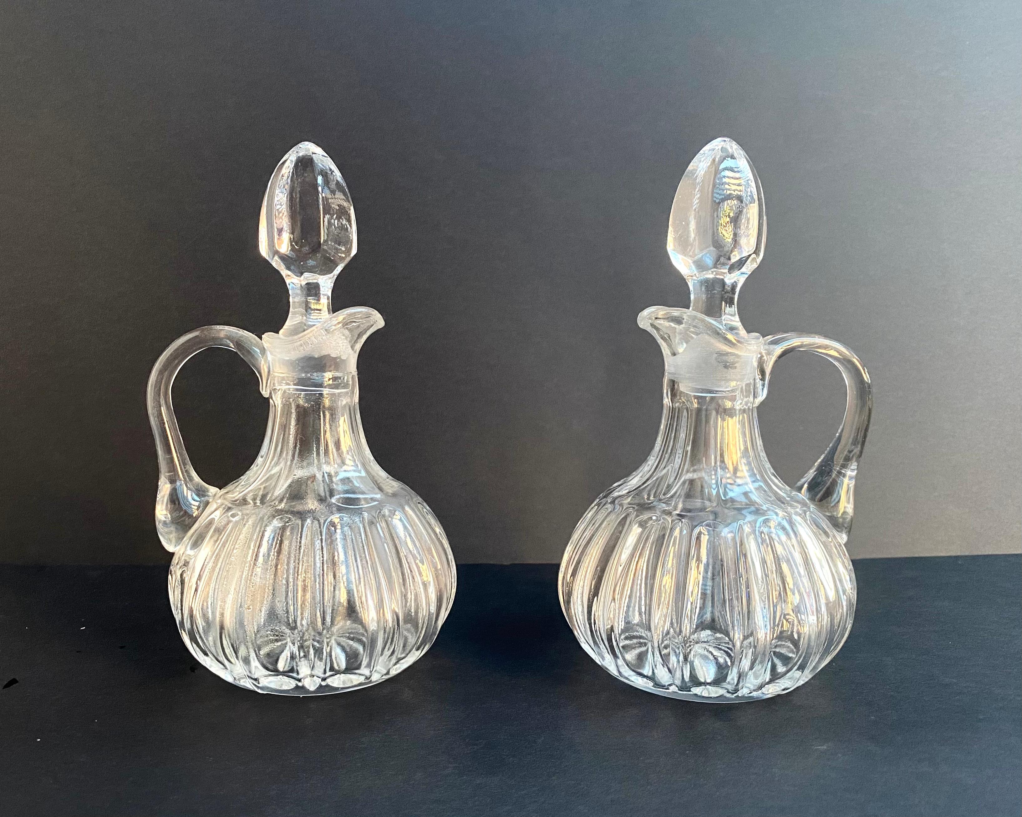 Beautiful Silver Plated and Glass Spice Cruet For Vinegar And Oil by Christofle Germany, 1950s.

A spice cruet is a part of the tableware for storing table spices: a centerpiece with vessels vinegar, oil and other liquids.

In addition to