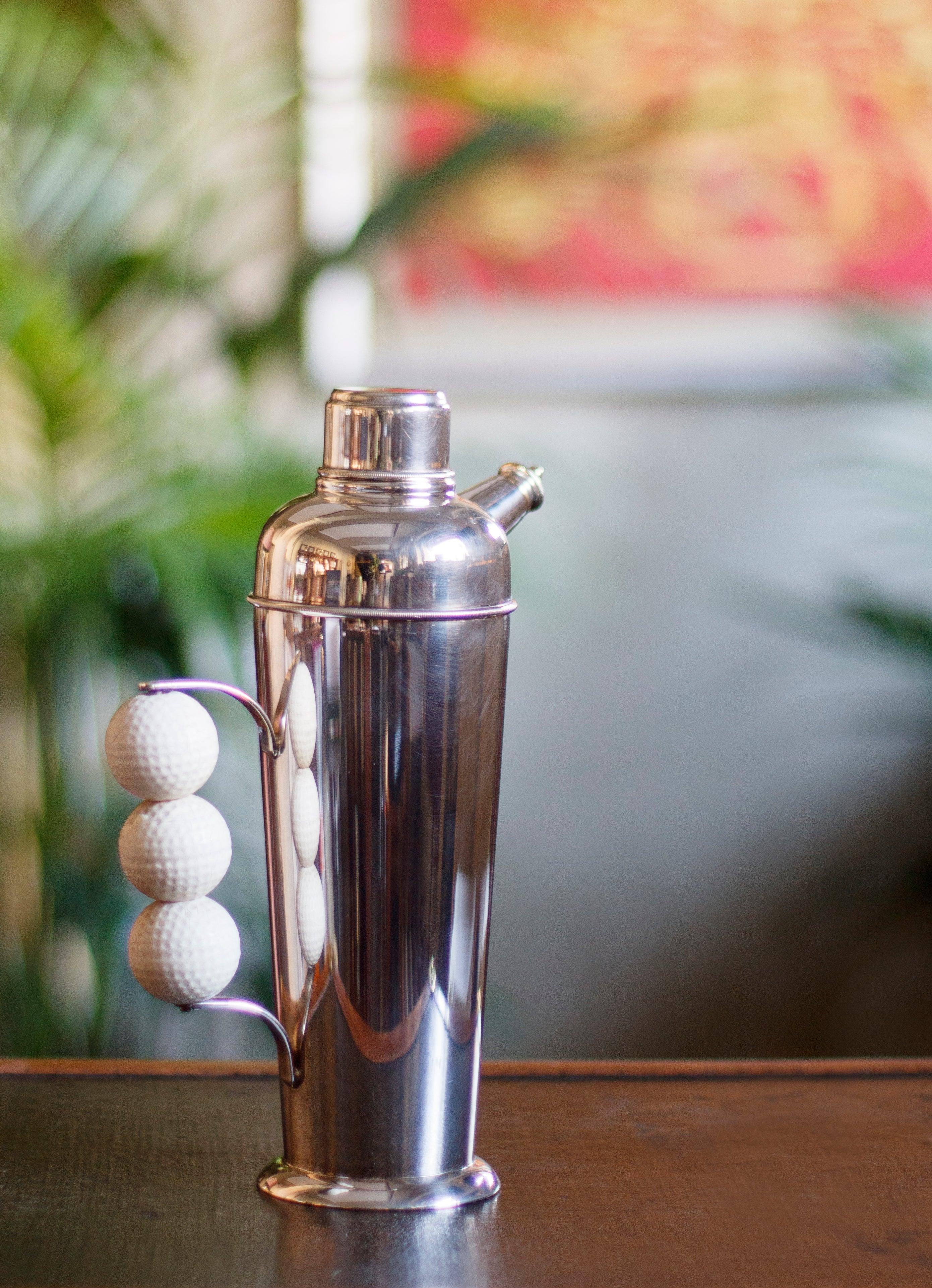 Unique and fine silver plated shaker with a particular Golf balls handle. The reason behind this interesting design lies in the fact that during Prohibitionism the serving of alcohol and any articles related to it were forbidden. Due to this, the