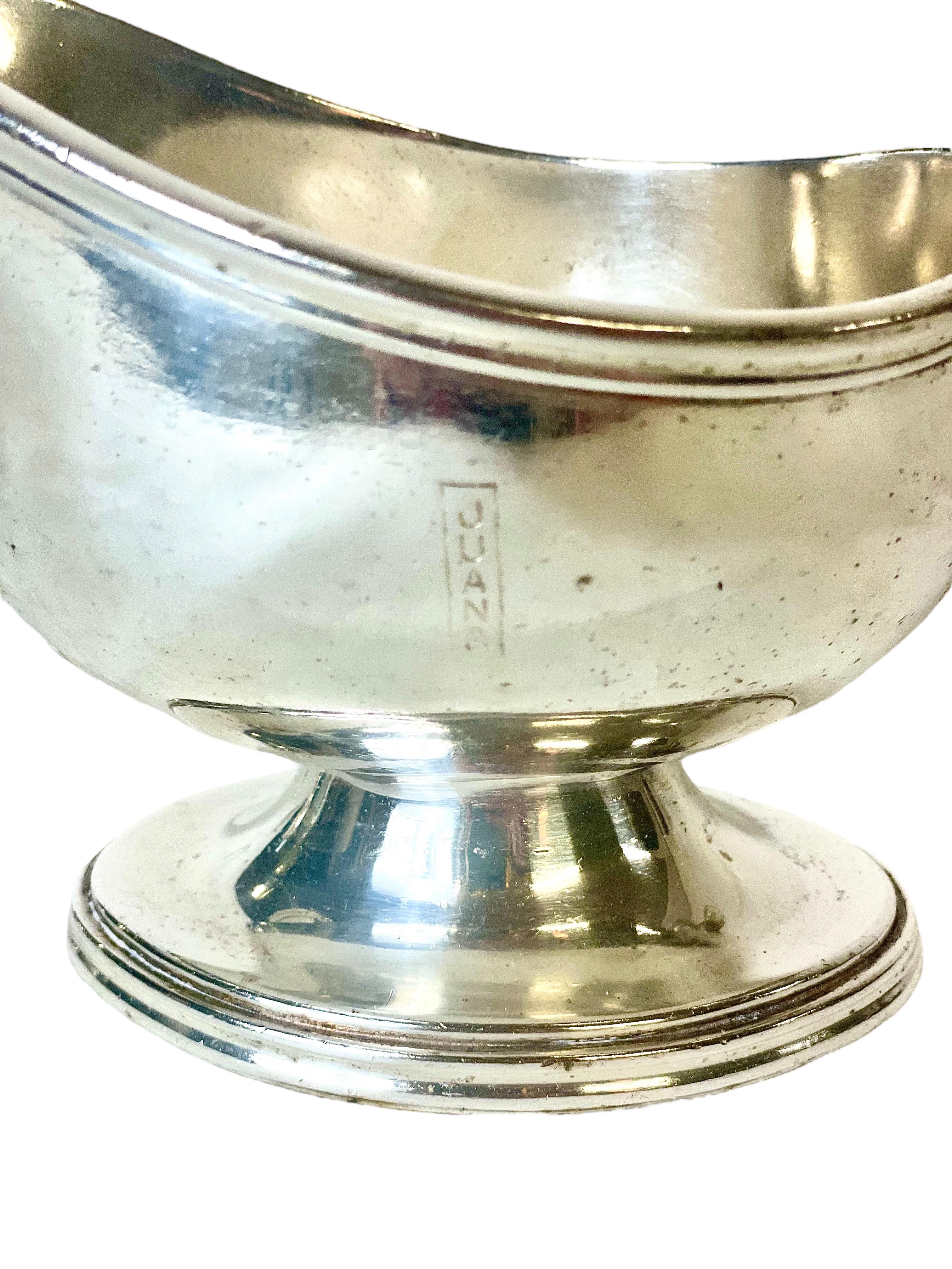 A handsome silver-plated sauce, or gravy, boat dating from around 1930, and featuring the engraved logo of the glamorous Hotel 'Juana' in Juan Les Pins, near Antibes. Stylish in design, with its circular base and wide pouring spout, it has been well
