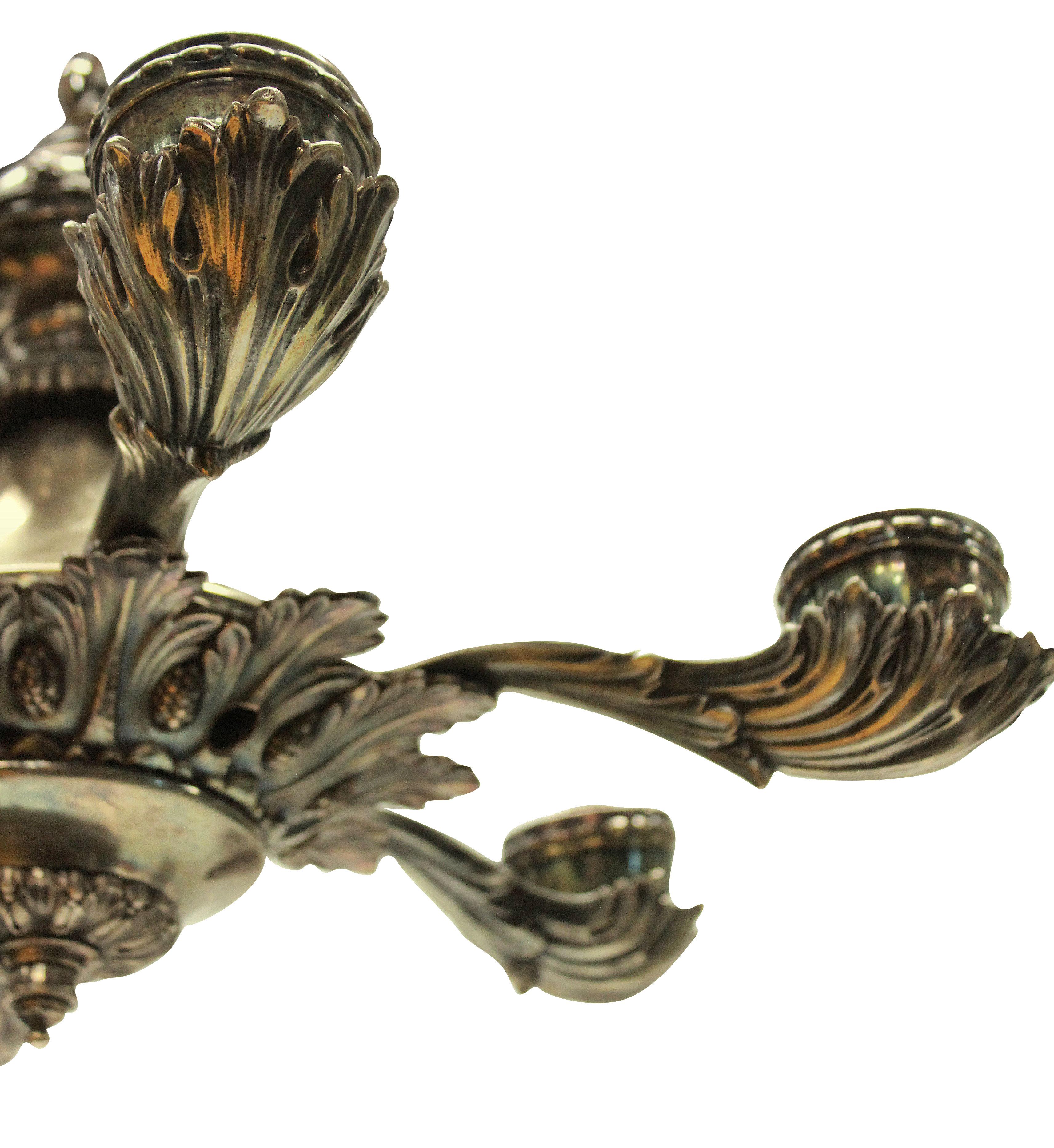 An English silver plated Greek revival chandelier of good crisp detail, depicting acanthus leaves.