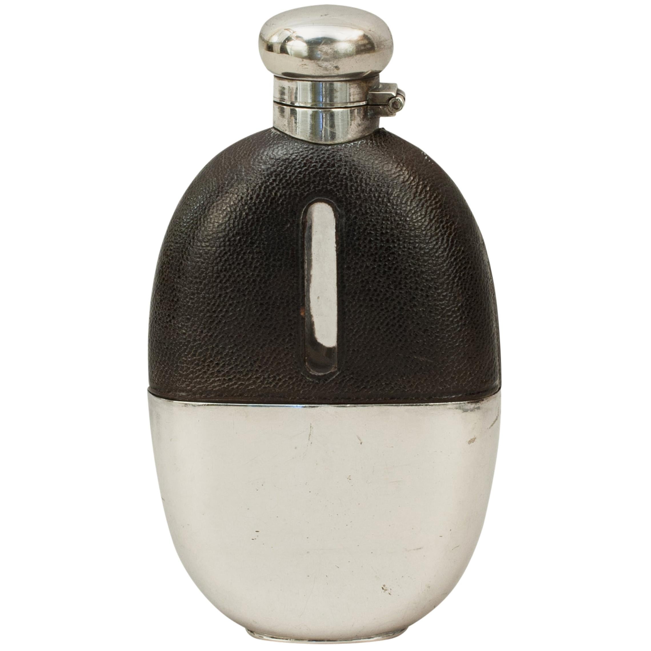 Large Leather Covered Glass Hip Flask with Silver Plated Top, circa