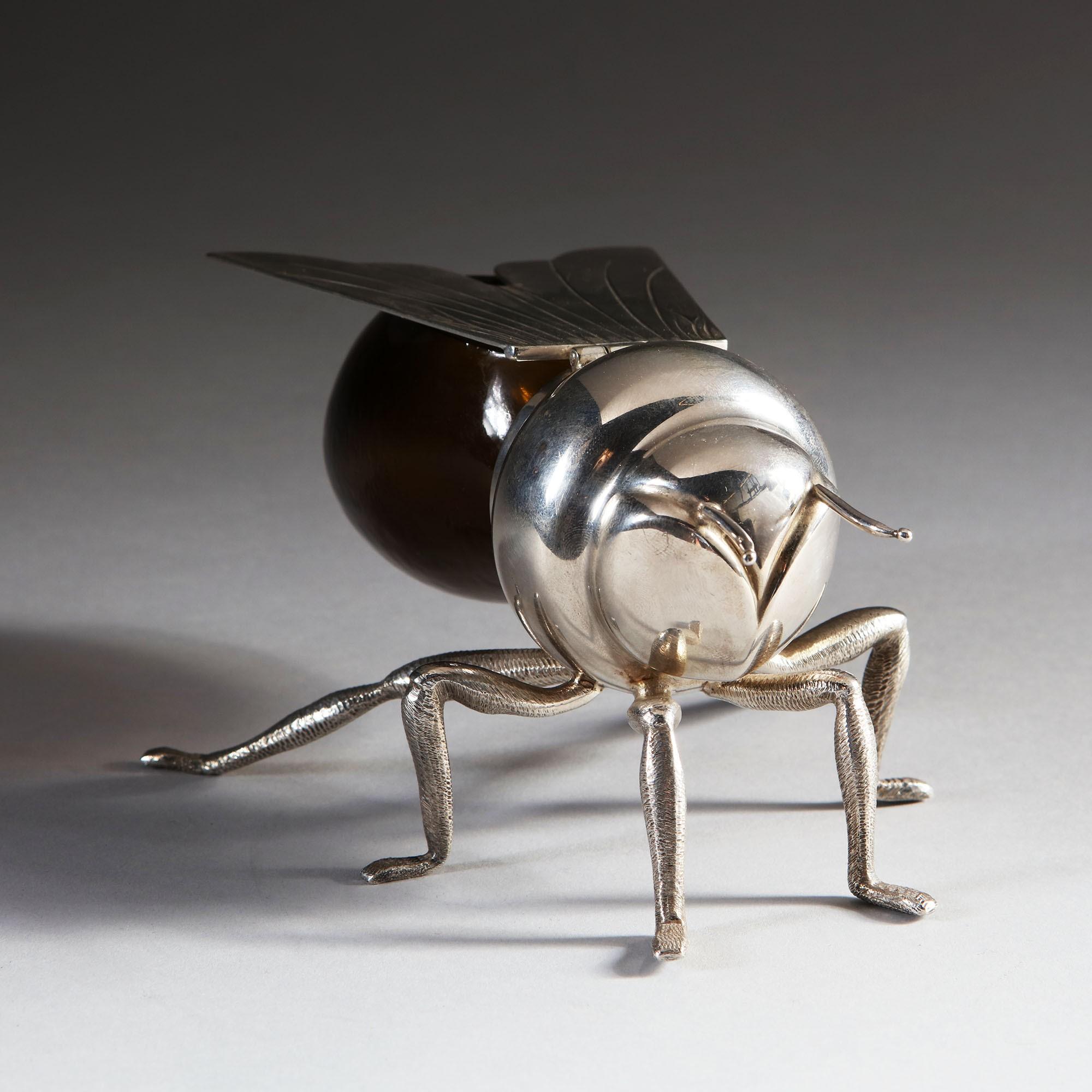 An unusual Edwardian silver plated honey pot in the form of a bee, with amber glass reservoir. Stamped to the underside.

By Mappin and Webb of Regent Street, London.