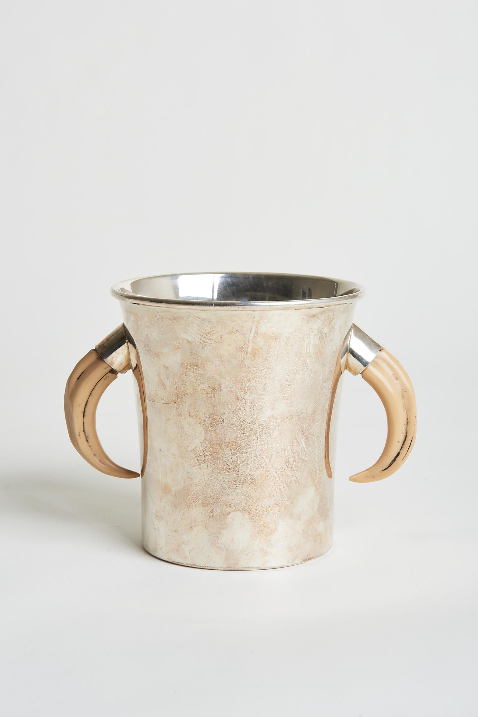 A silver plated horn champagne cooler.
Spanish, Circa 1970.
The wine cooler 16 cm high by 20 cm high.