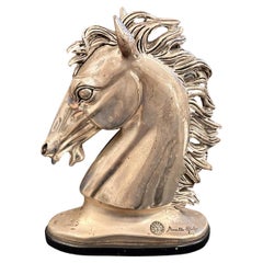 Cabeza de caballo bañada en plata