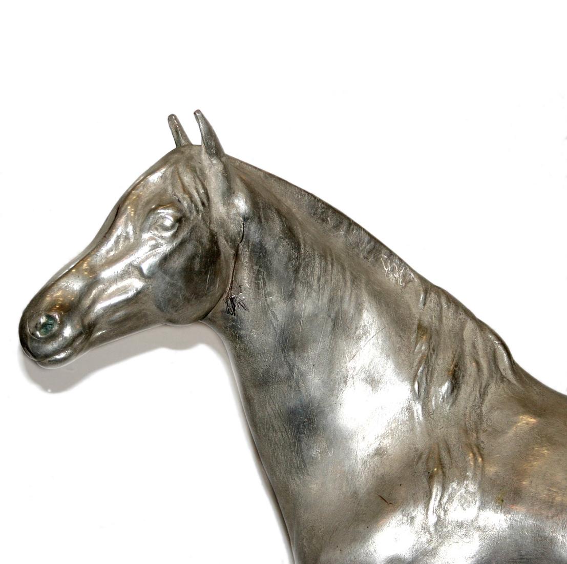 A circa 1900 English silver plated horse sculpture.

Measurements:
Height: 23