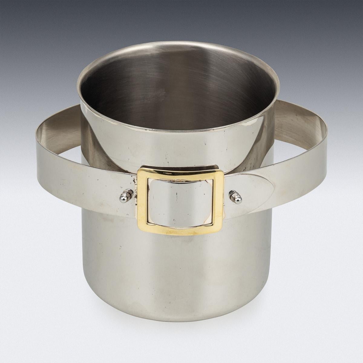 A superb mid-20th Century silver plated ice bucket. The bucket is adorned with a brass belt buckle detail and offers ample space to accommodate a bottle of champagne. It serves as an ideal enhancement for any home, whether contemporary or