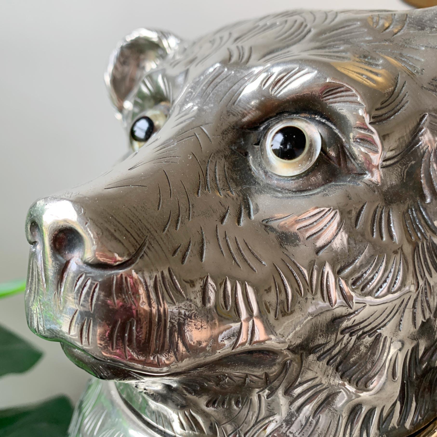 Silver plated bear champagne/wine bottle holder.
1970s Italian 

A fantastic Italian Champagne bottle holder, shaped as a bear with clear glass eyes, the body detailing formed to simulate fur, paws to the side, an absolutely charming piece. 
The