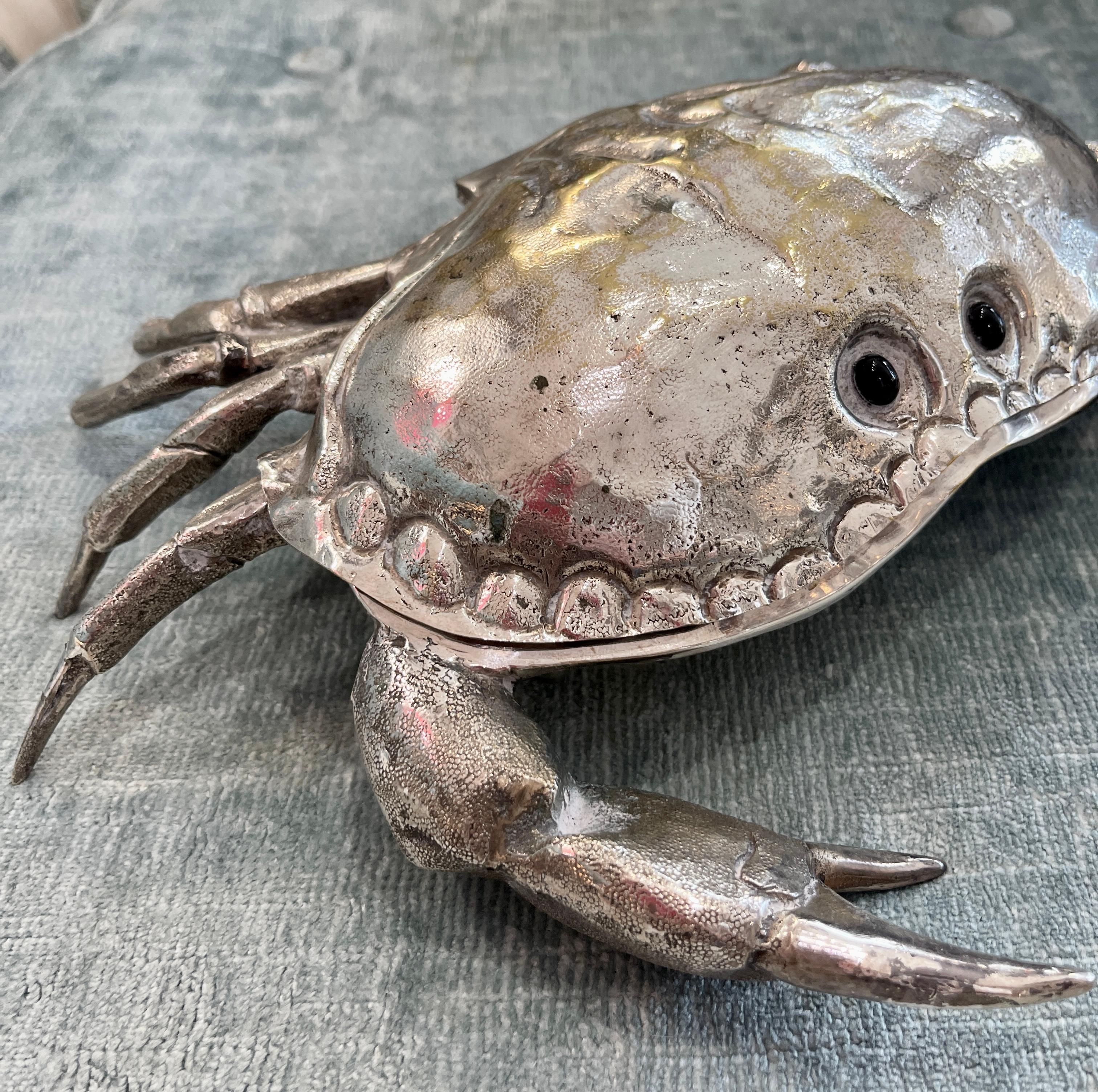 Just in this strong and life size King Crab caviar bowl , made in Italy.
Franco Lapini (1936-2017)
The caviar bowl is Blue Murano glass, the silver surface is slightly structured, rough in some areas, the black glass eyes are original.
This crab has
