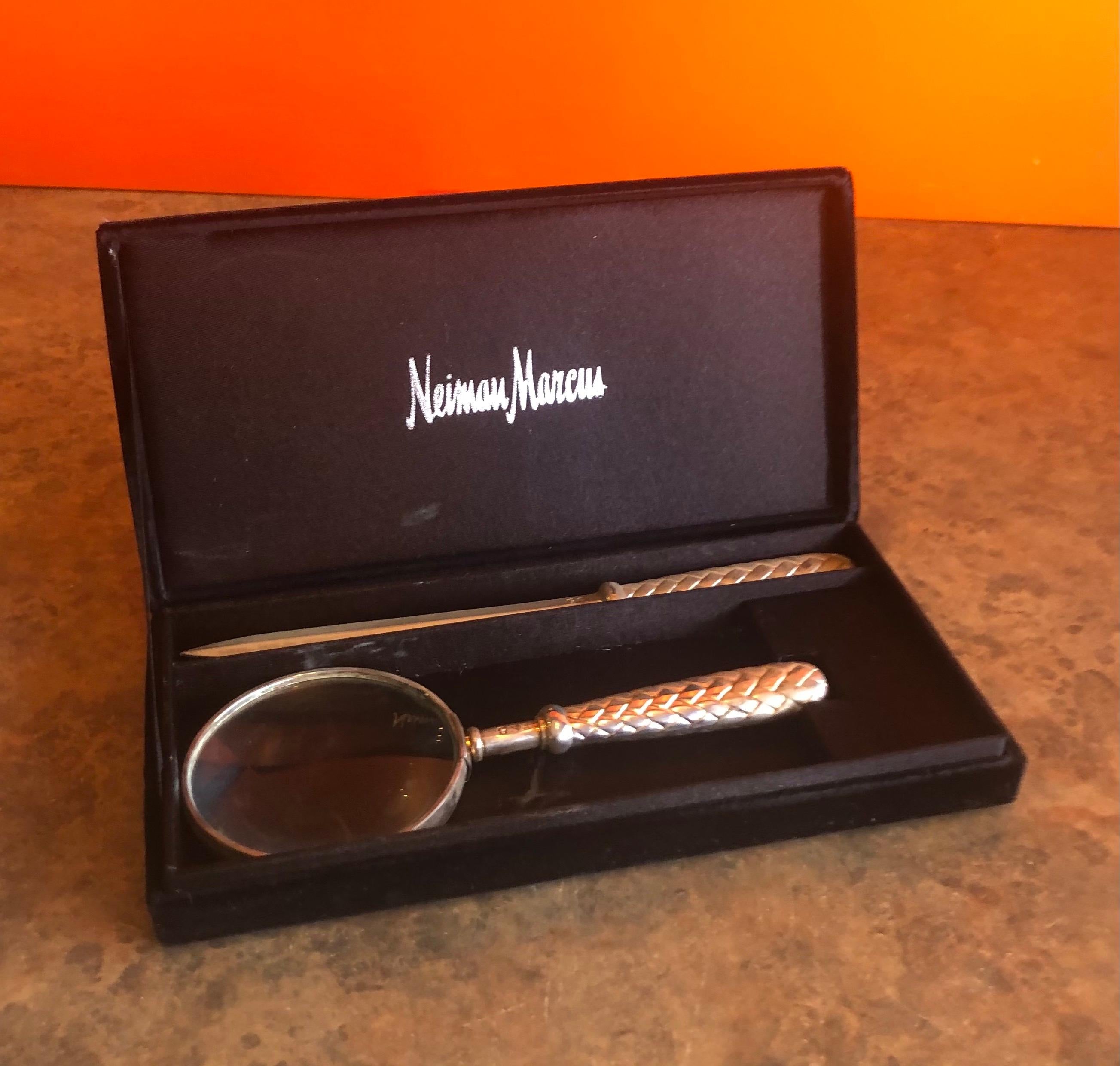 Vintage silver plated magnifying glass and letter opener set by Godinger Silver Art (GSA) for Neiman Marcus, circa 1990s. The set is in very good vintage condition and comes with the original NM box. The handles are in an intricate basket weave