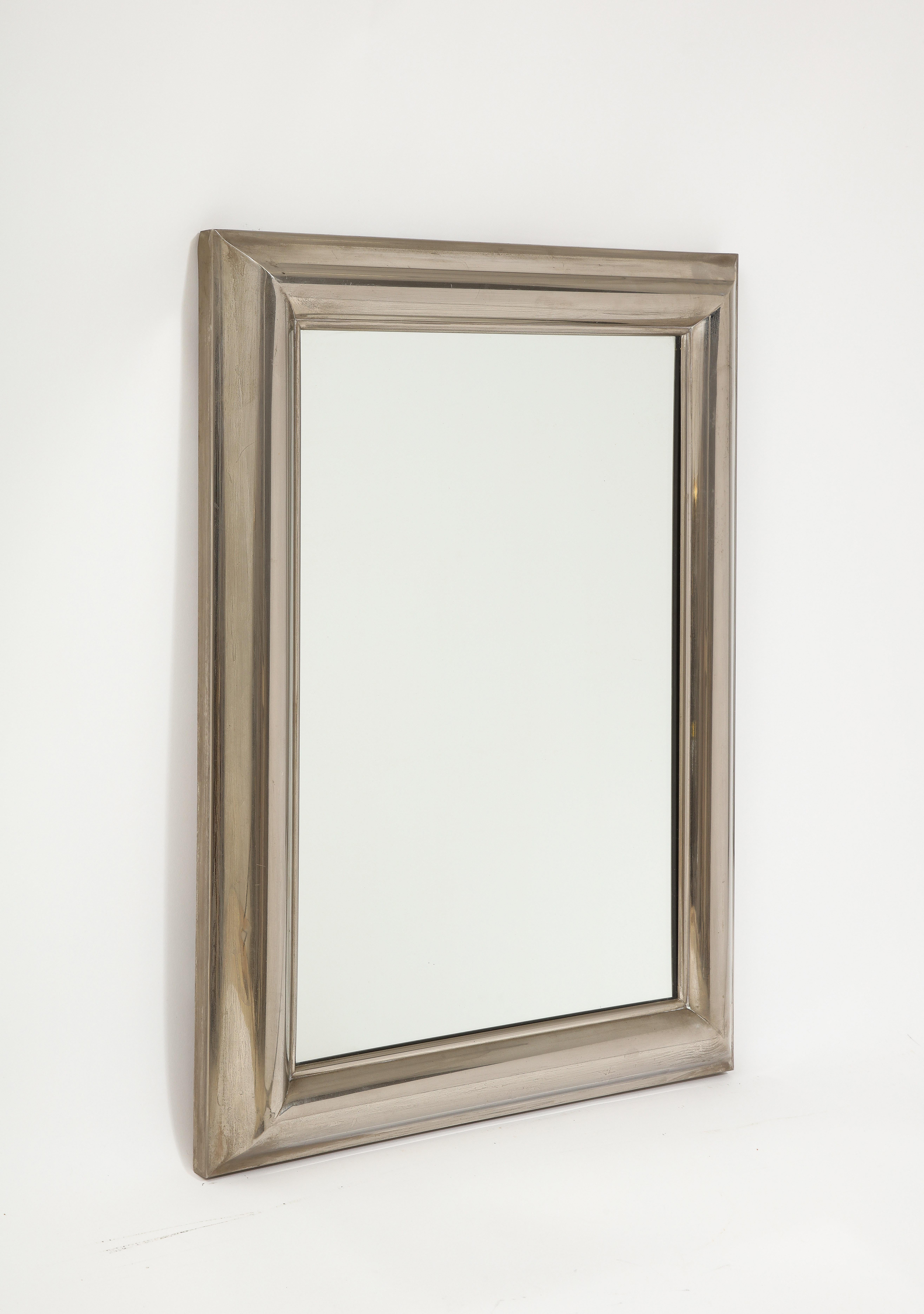 Handsomely proportioned silver plated mirror with great patina and original glass.