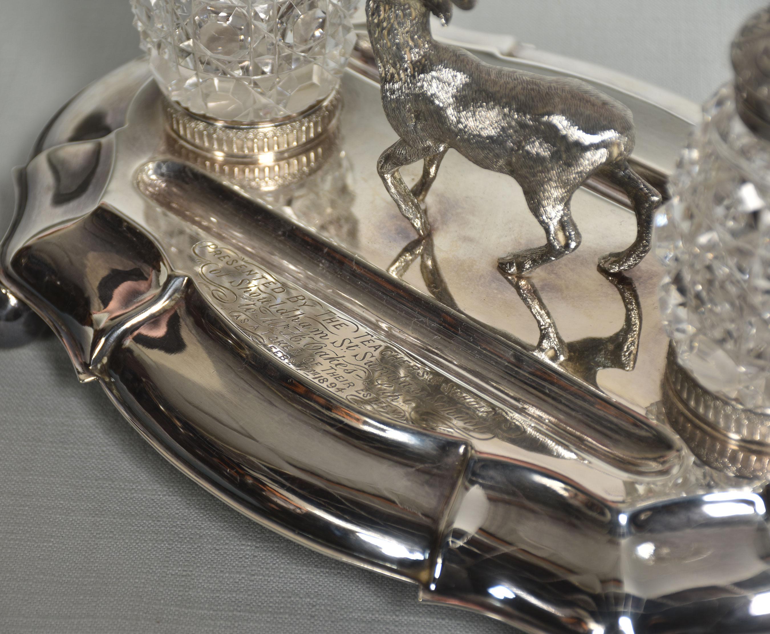 19th-century silver plated oval desk stand with a central study of a standing stag flanked by twin cut glass bottles with plated foliate decorated cover. All raised on four ball feet. Stamped Wilson & Co, Sheffield.
Dimensions
Height 5.5
