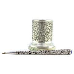 Silver-plated pen holder with floral motifs, wooden interior