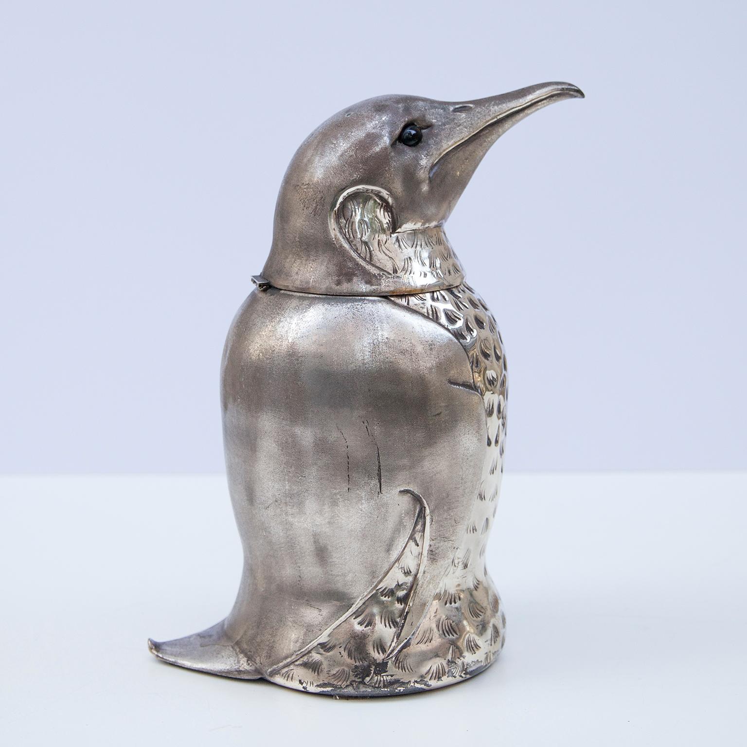 Wonderful penguin ice bucket or wine cooler Italy, 1960s. The penguin is made of silver plated metal with a glass eyes and a metal inlay. A “Must Have” piece for every private cocktail bar.

  