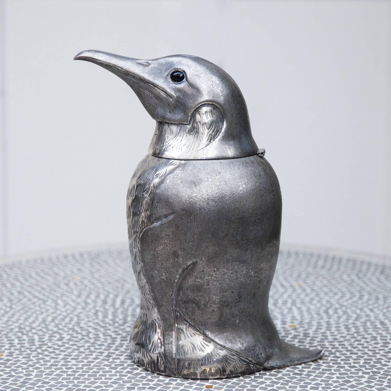 Wonderful penguin ice bucket or wine cooler attributed to Franco Lapini, Florence, Italy, 1970s. The penguin is made of silver plated metal with a glass eyes and a metal inlay.
A 