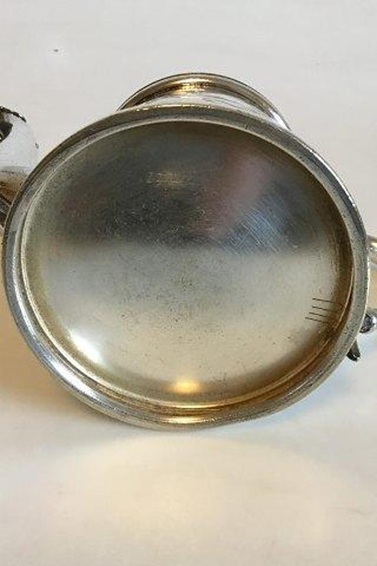 silver pitcher with lid