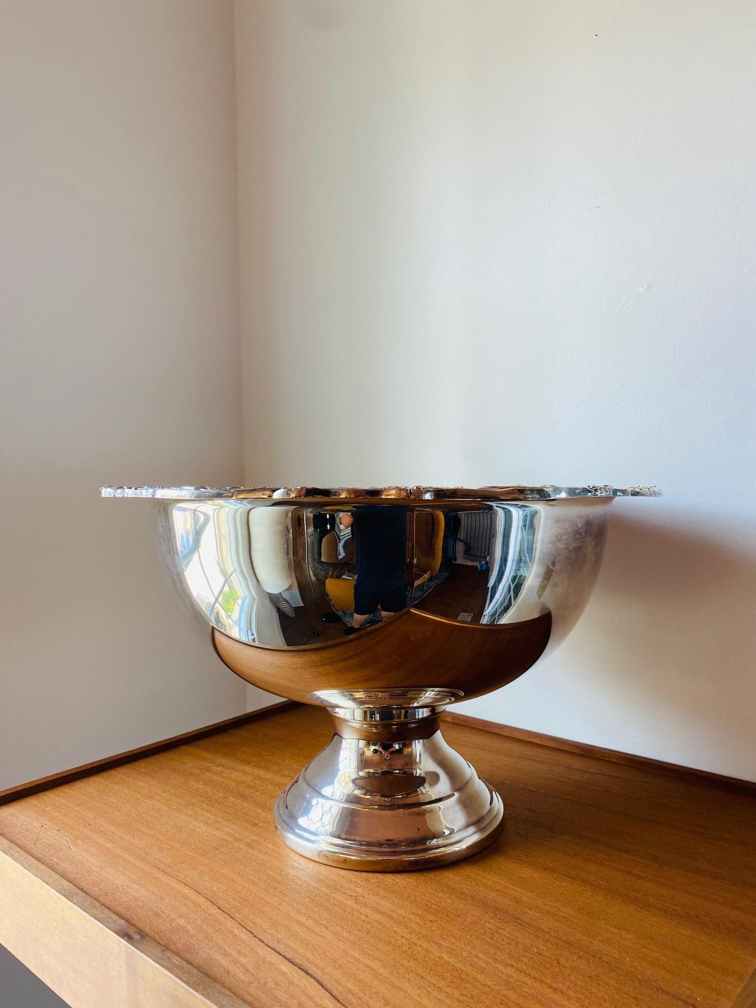 Silver Plated Punch Bowl with Flower Shell Rim Design.This large bowl is unique with its floral and shell border, original stamp, great style and form. Circa Late 20th Century. Measurements: Bowl: 10.25