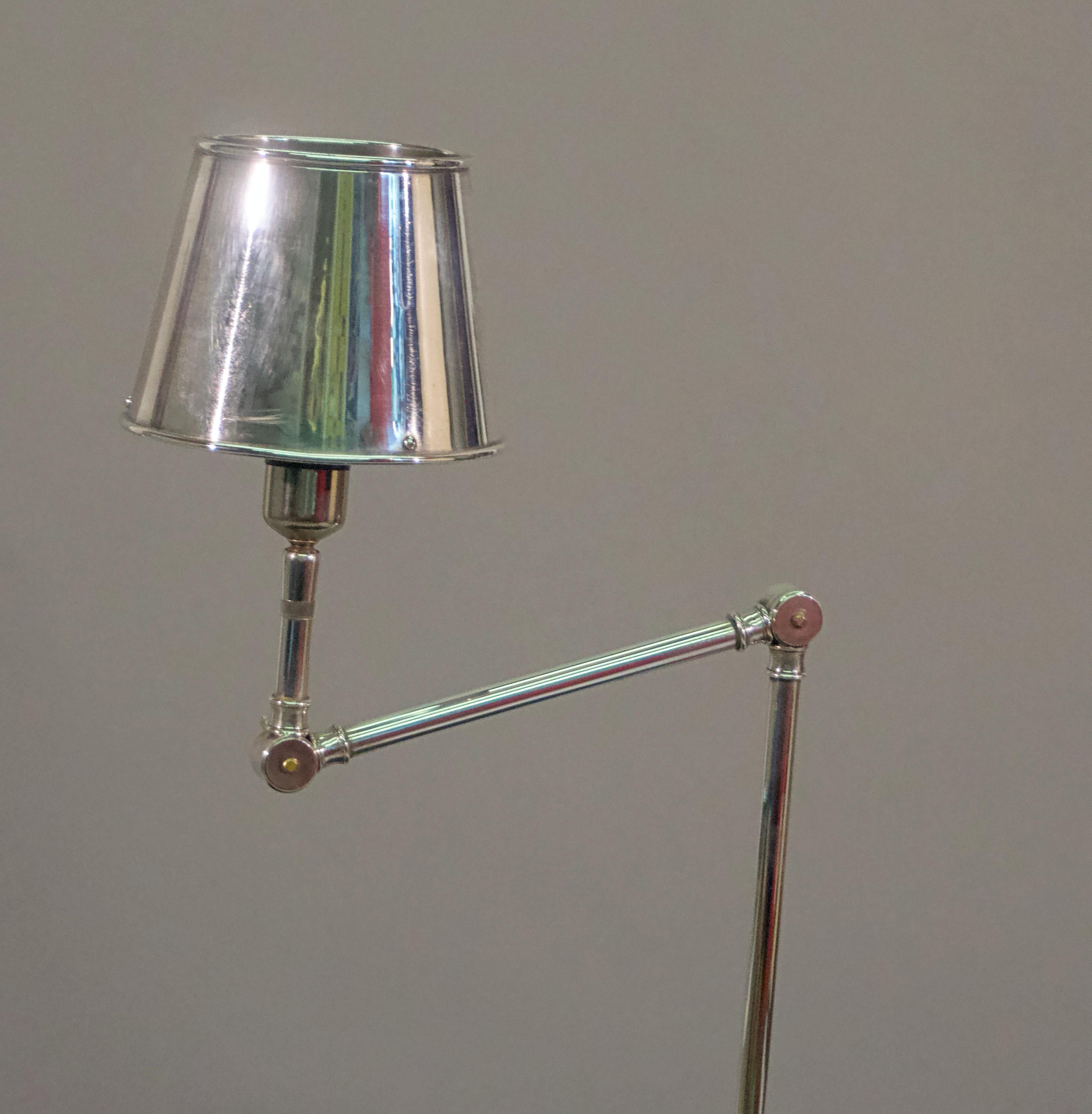 Reading lamp
Cast in solid brass, triple plated in silver, polished and sealed in lacquer
Measures: Height 44”, base 12”, shade 5 1/2”.
