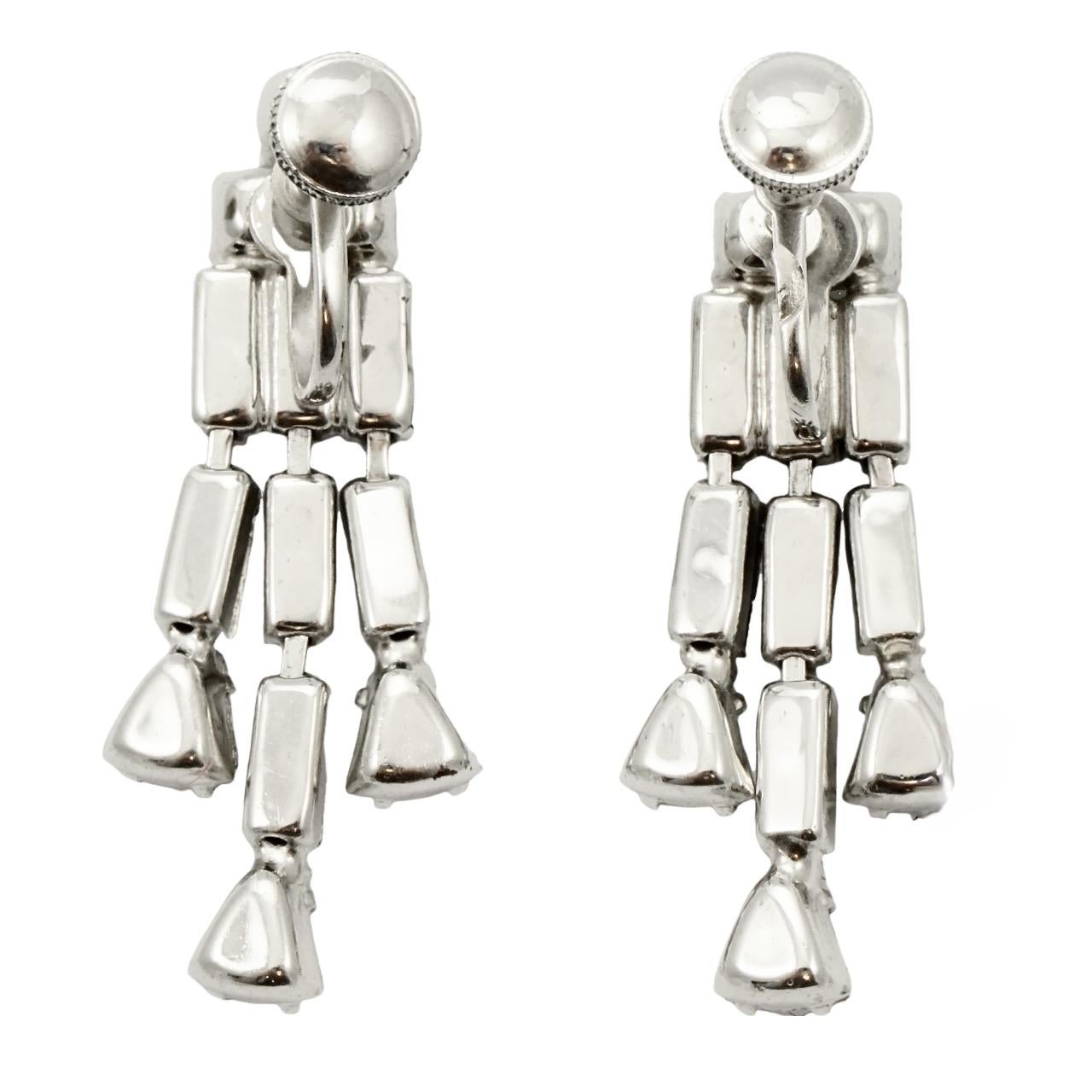 Beautiful silver plated screw back earrings, with sparkling baguette and triangular rhinestones, with a round rhinestone at the top. Measuring length 4.1 cm / 1.6 inches.

These are lovely vintage drop earrings for the evening or a special occasion.
