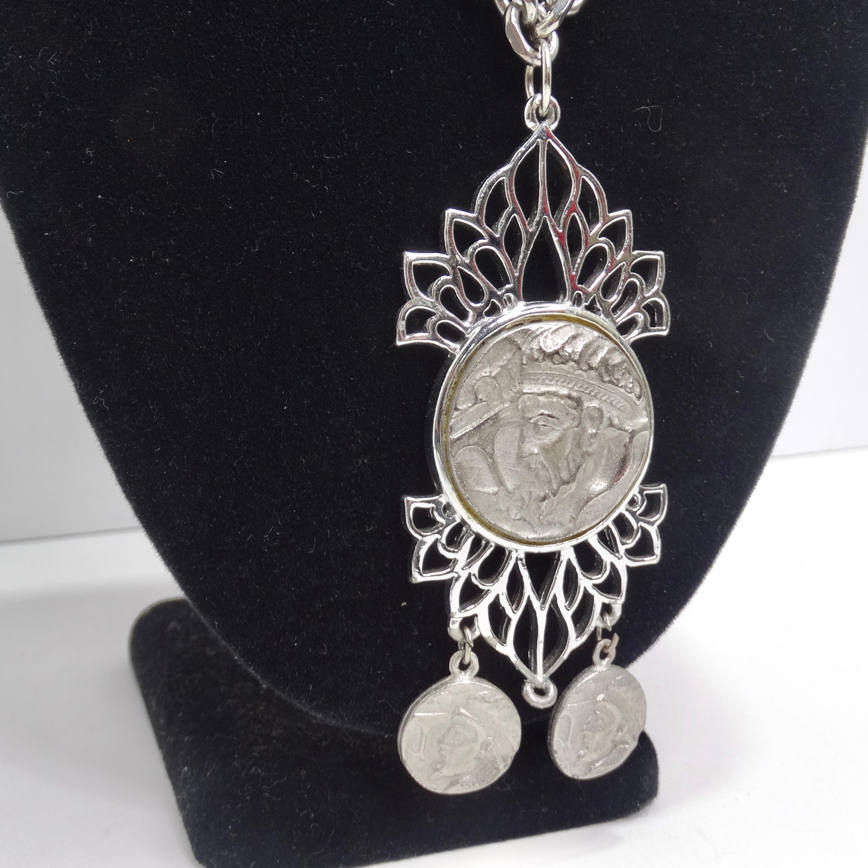 Elevate your style and transport yourself to ancient times with our remarkable Silver Plated Roman Coin Medallion Pendant Necklace. This striking piece of jewelry combines a silver chain with a dramatic Roman coin medallion pendant featuring