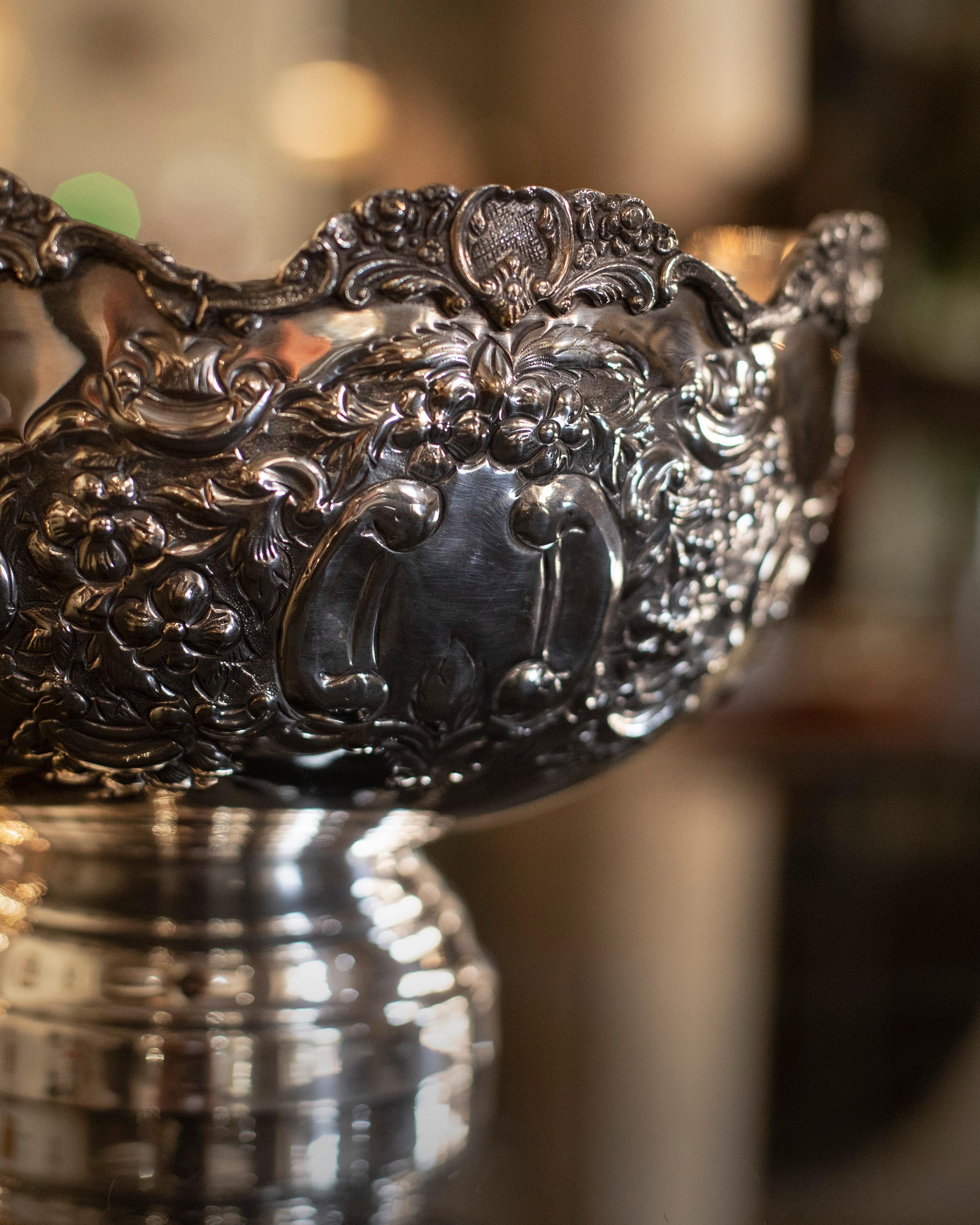 English silver plated champagne bucket from 1910. This rose bowl has a very elegant and beautiful decoration Brandimarte embossed. 

A stylish way to keep your champagne perfectly cool.