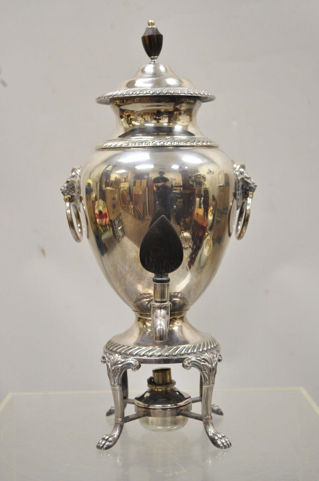 Silver plated Samovar coffee tea Urn Regency lions By International Silver Co. Item features removable lid and bunson burner, lion head, drop ring handles, wooden finial, original stamp, very nice antique item. Circa Early to Mid 20th Century.