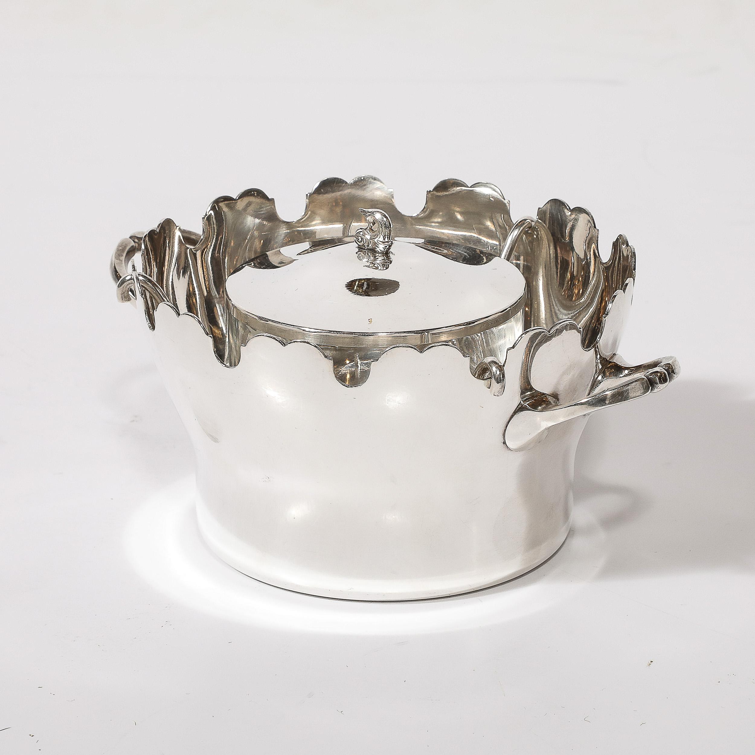 This Silver plated Scalloped Edge Caviar Dish by Plasait originates from France during the 20th Century. Features an elegantly achieved profile in plated sterling with a scalloped edge and curvalinear handles extending from either side. The inside