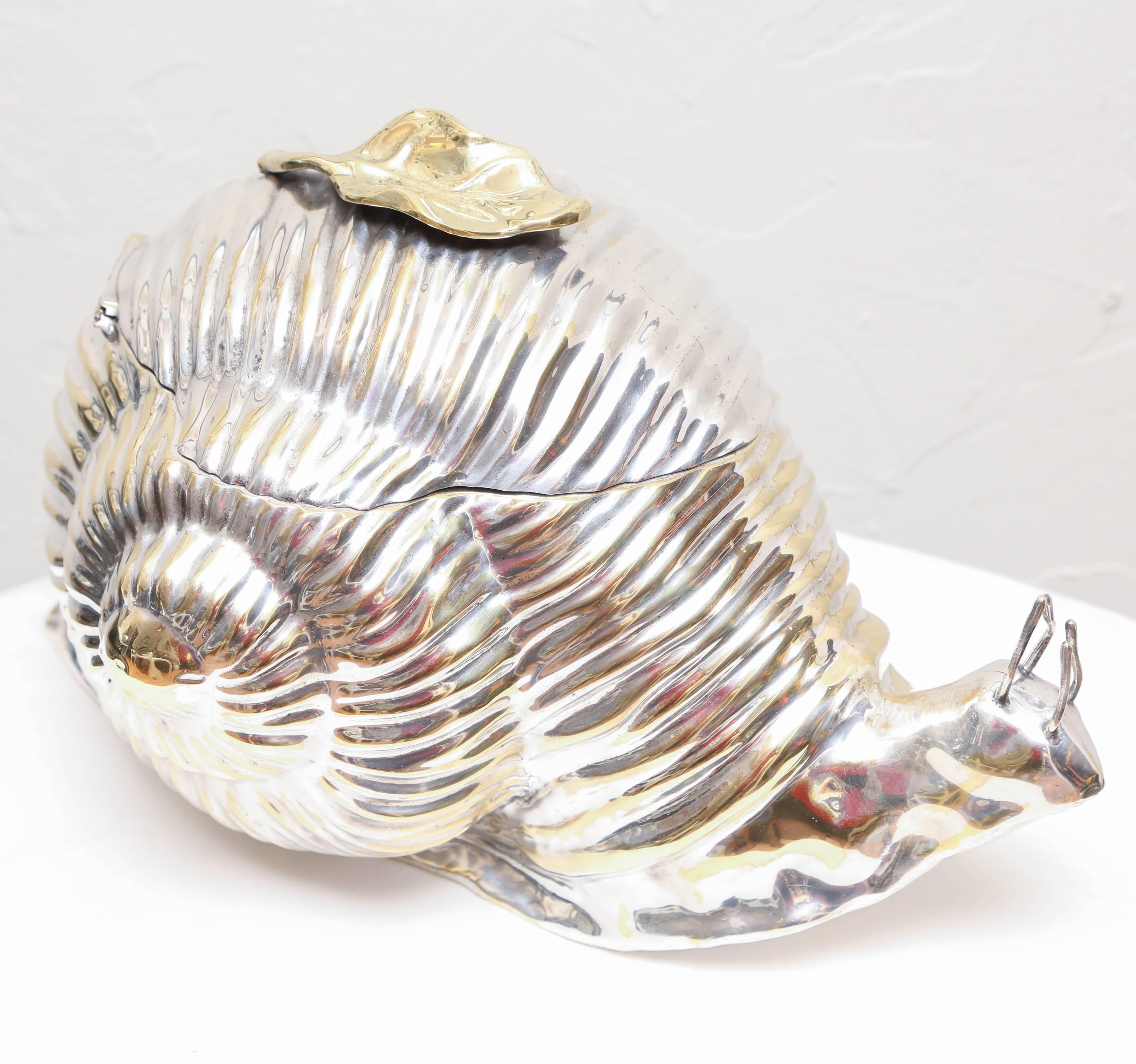 Sculptural silver plated ice bucket in the form of a giant snail. Made in Florence, Italy by Teghini. A highly decorative addition to any bar.