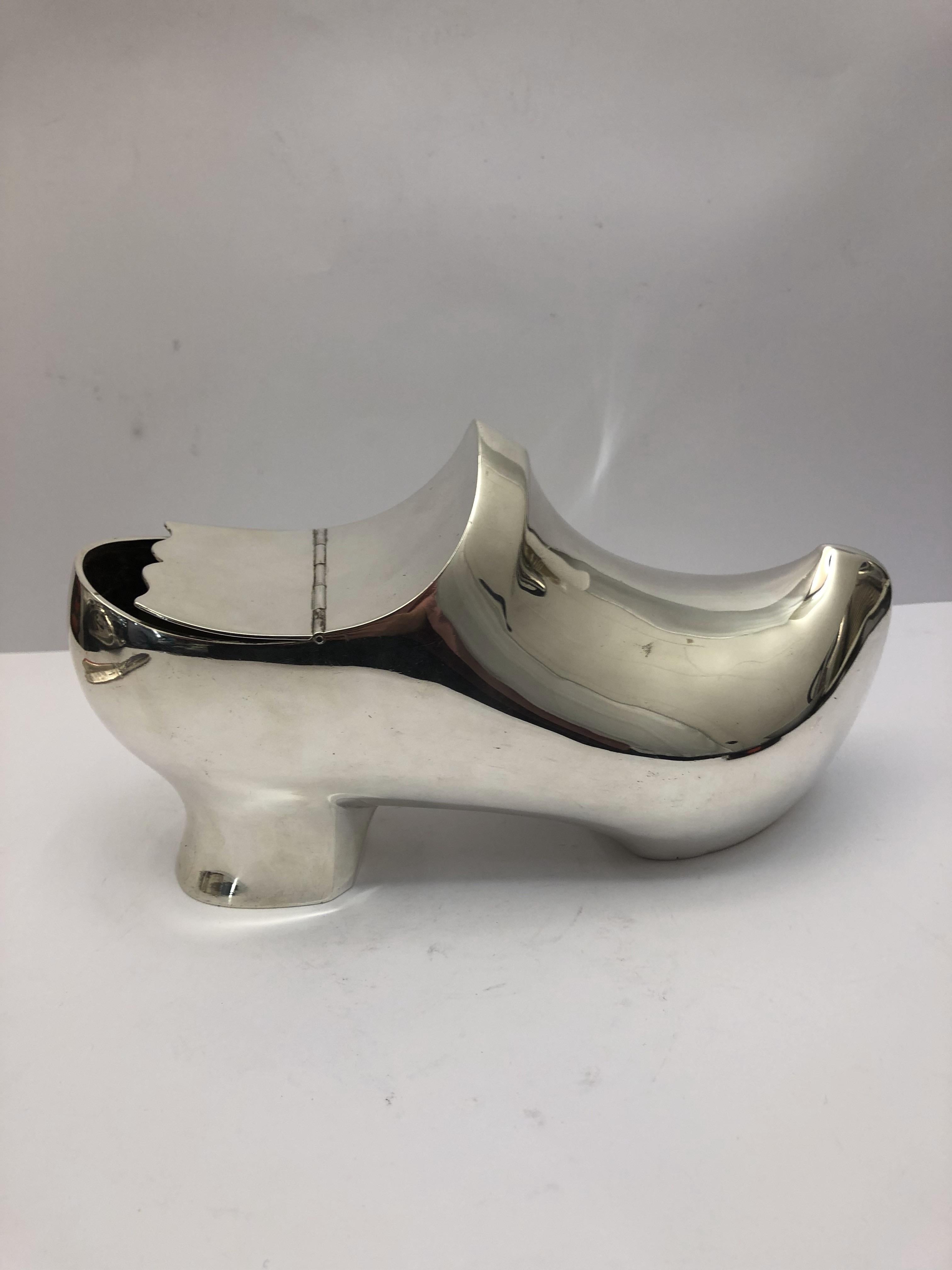 Silver plated spoon warmer in the shape of a clog. English, circa 1900.
  