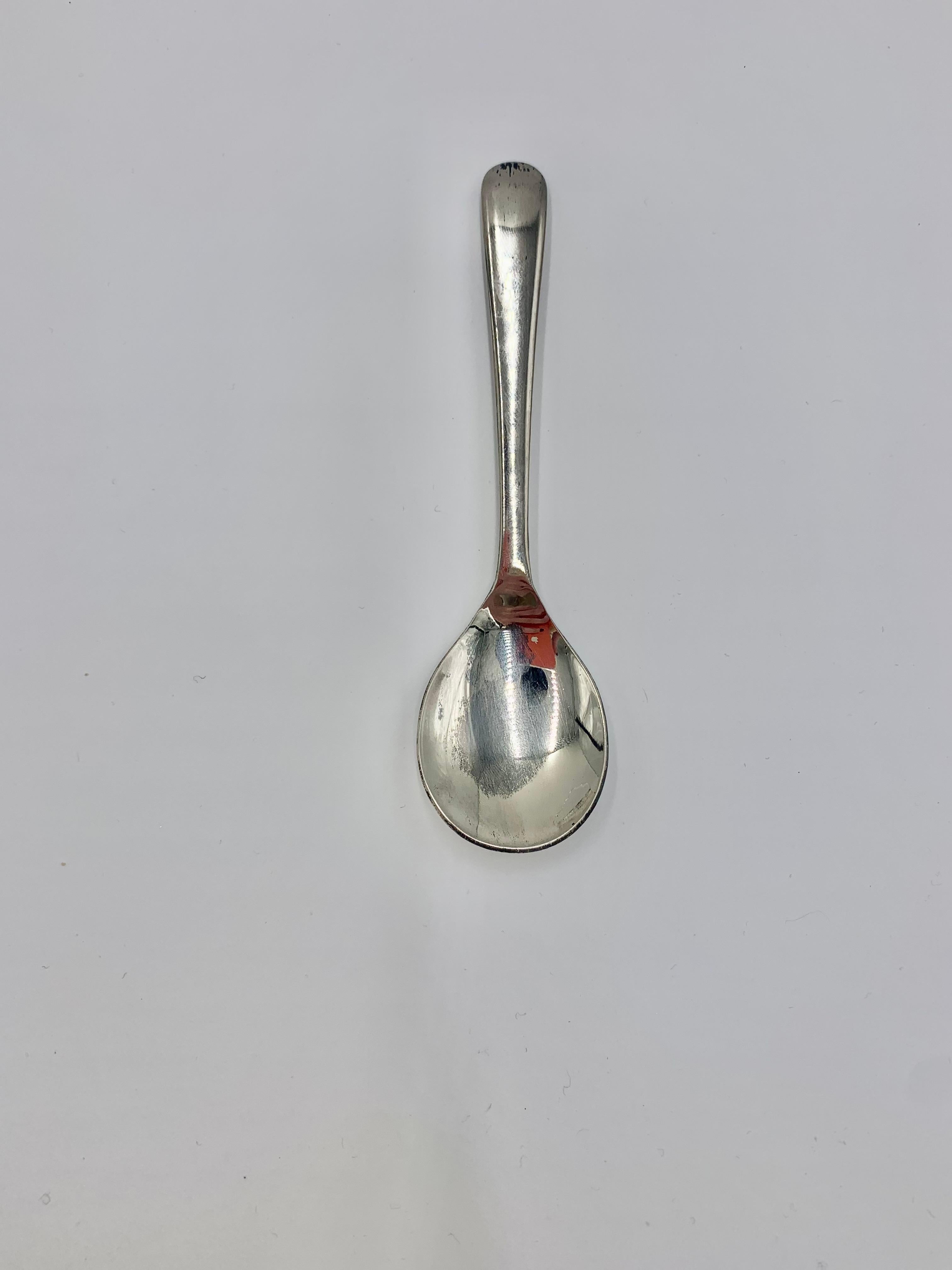 silver sugar bowl with spoon
