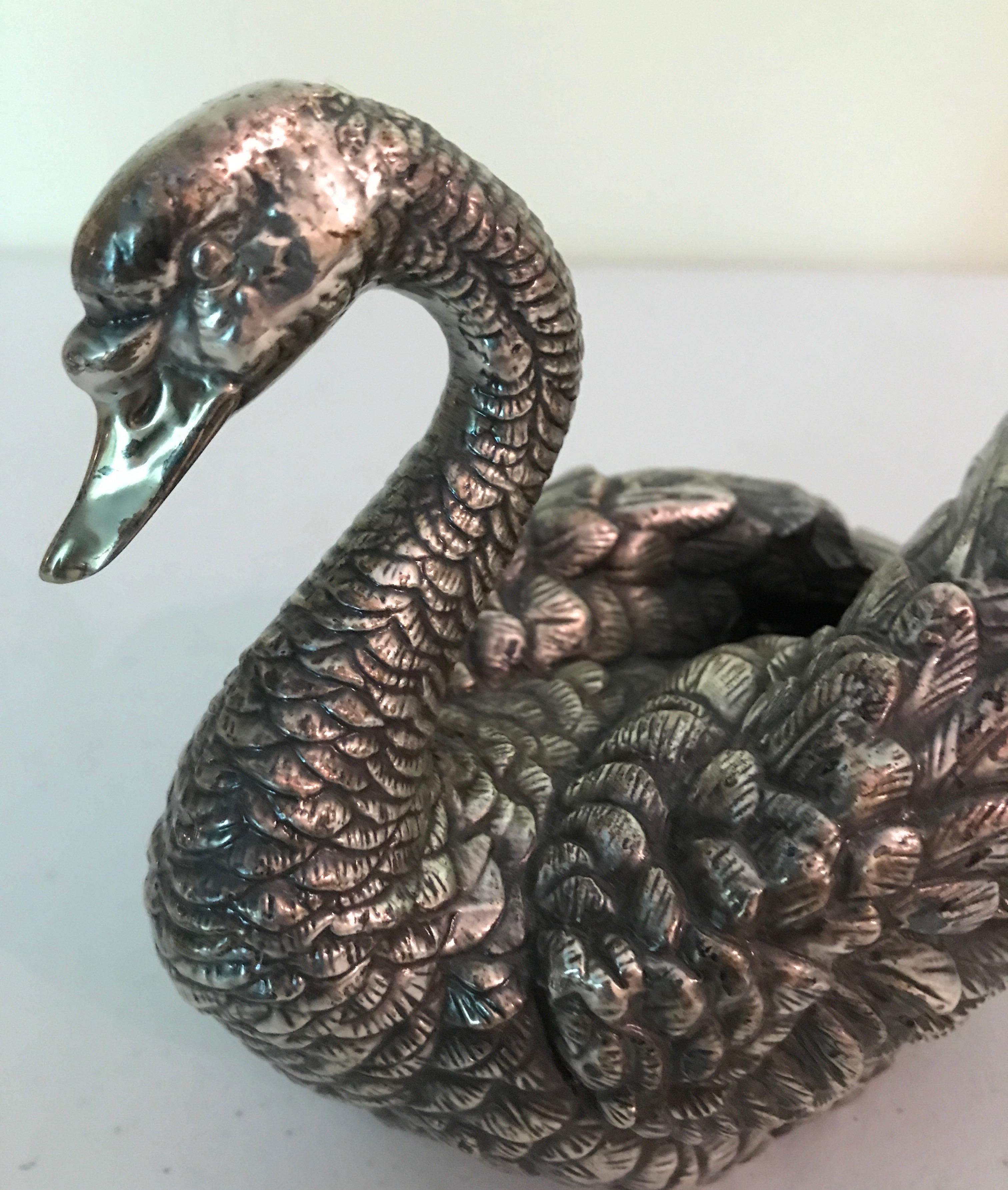 Silver plated highly detailed swan sculpture.