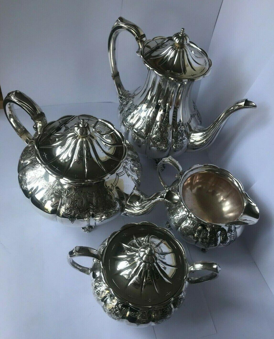 In good vintage condition, this wonderful tea set consists of a tea pot, a coffee pot or a pot for hot water, a milk jug and a sugar bowl.The large jug would also be lovely as a coffee pot.

All the pieces stand on four delicate feet.
The handle of