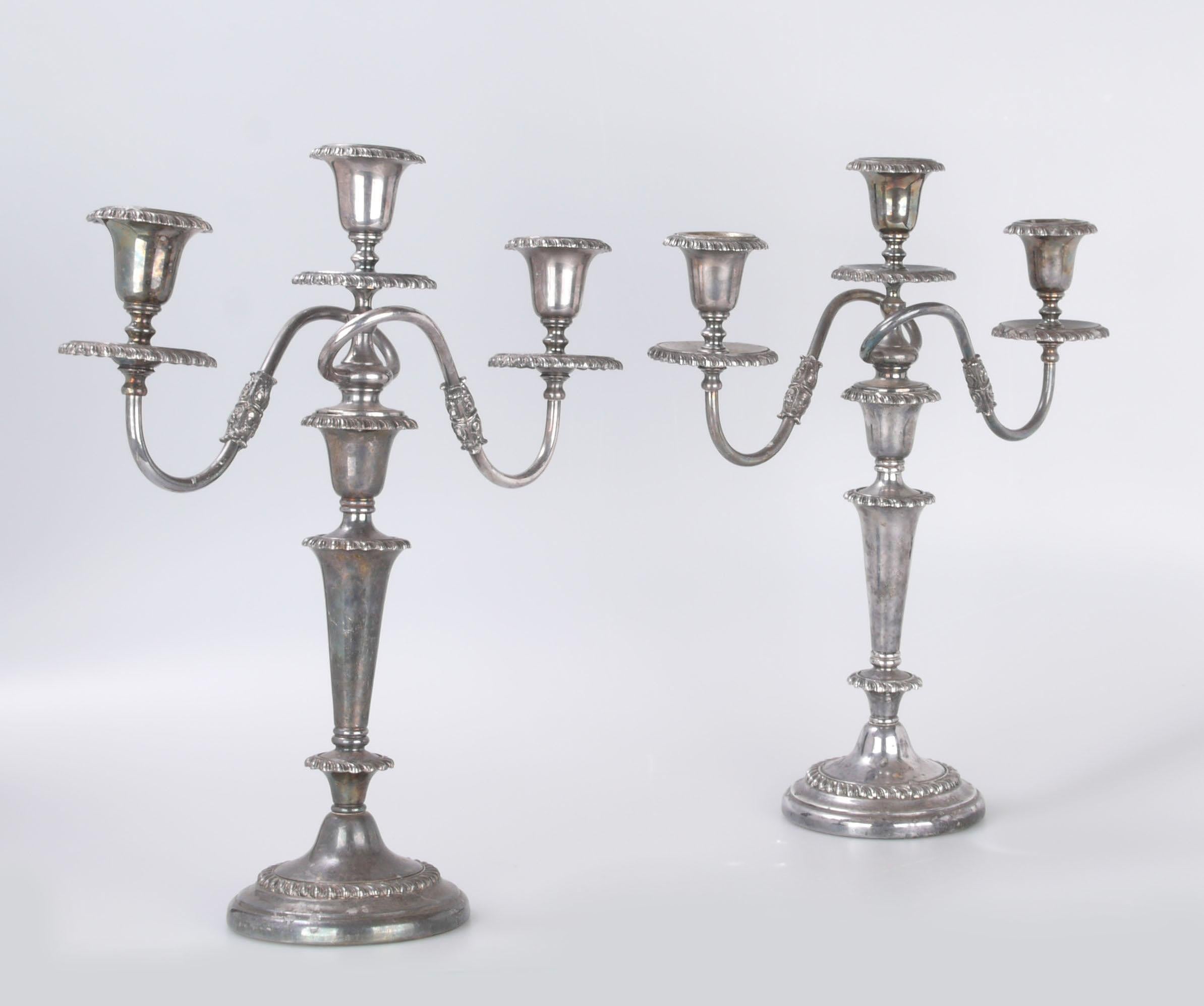 A pair of Victorian Friedman silver plated three-arm convertible candleholders or candelabras.
Each piece has the capacity to hold either three lights or just one (with the removal of the topmost piece, as shown in picture).
Friedman mark on the