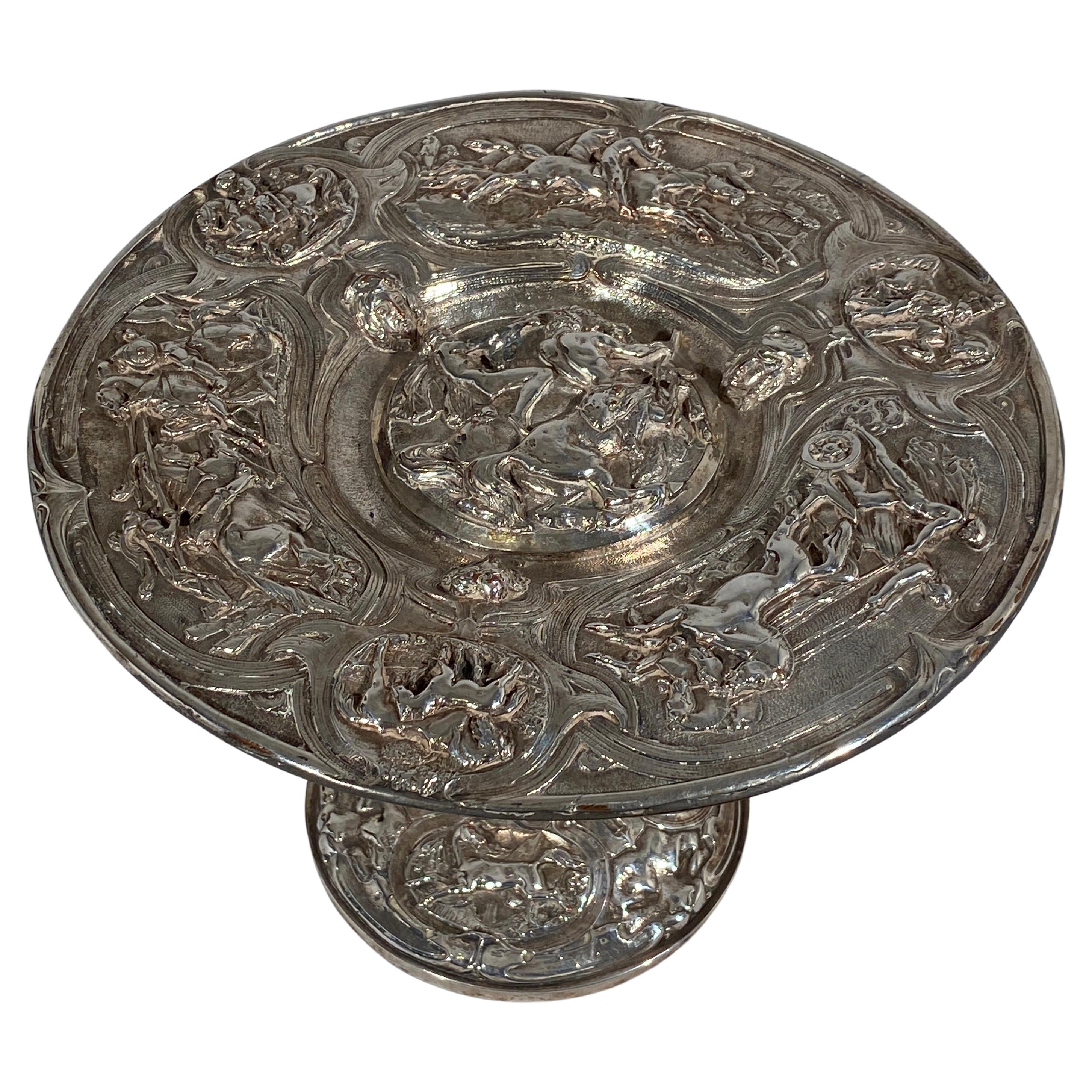 Silver Plated Trophy Dish Tazza with Gladiatorial and Horse Racing Scene

Minor flaking with dark tarnishing in areas. 

