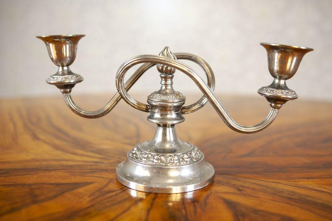 Silver-Plated Two-Armed Candle Holder Circa 1930-1940

An English silver-plated two-armed candle holder, dated around 1930-1940.