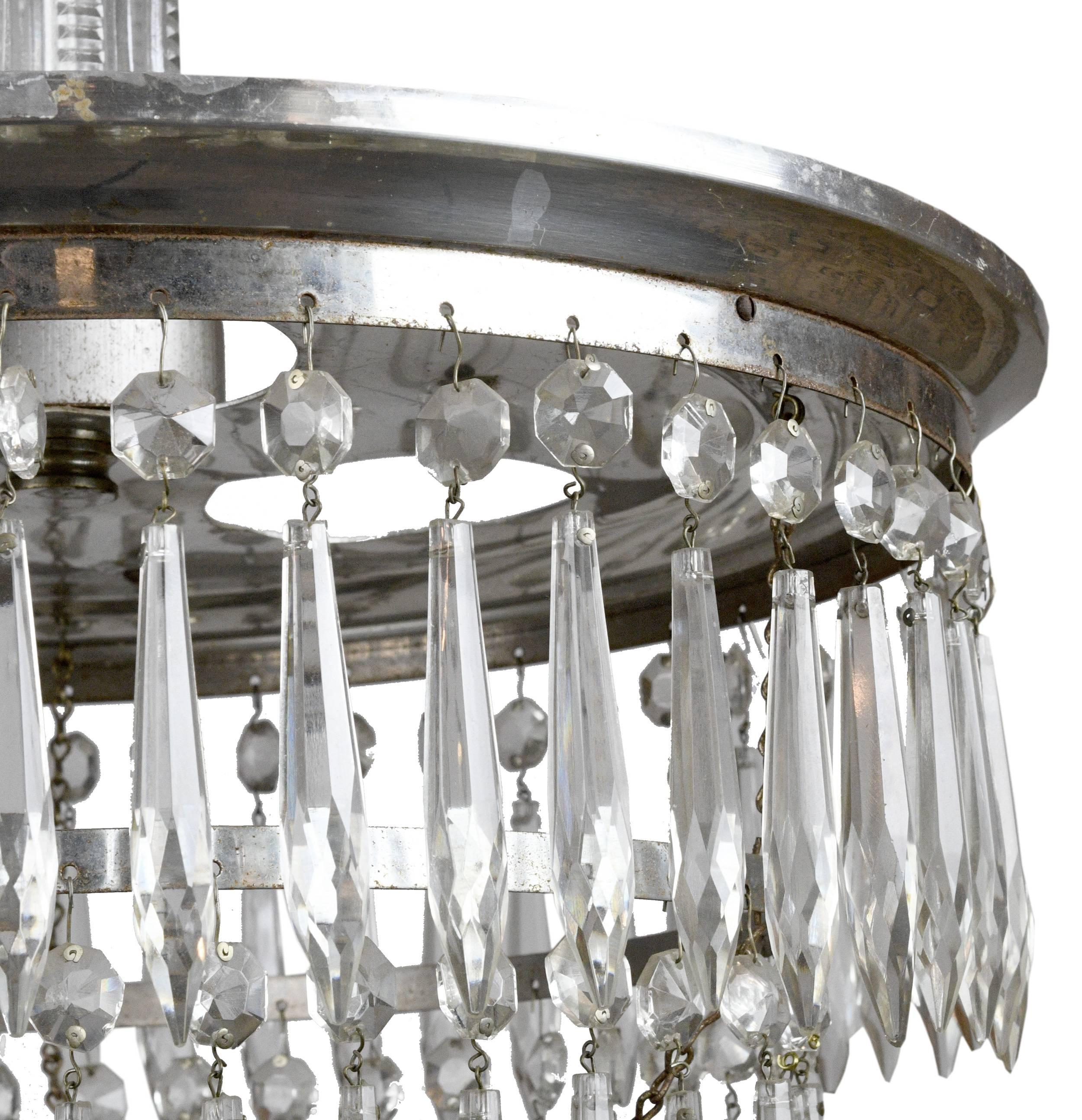 Three-light silver plated wedding cake chandelier complete with four tiers and a beautiful crystal ball finial. Elegant and refined, this fixture will add a timeless touch to any space, 

circa 1925
Condition: Excellent
Finish: Original
Country