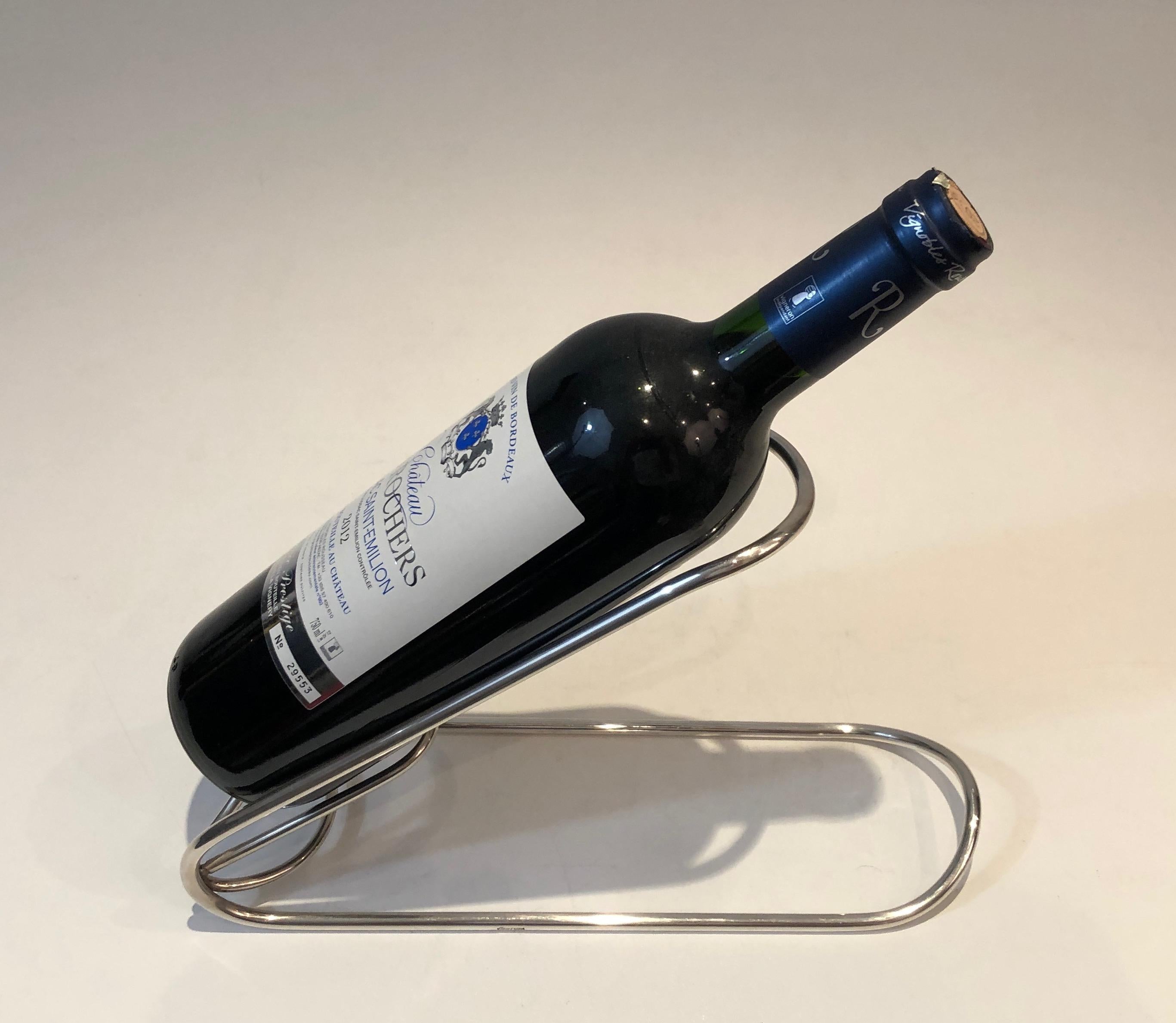 This unusual wine holder is made of silver plated. This is a French work, circa 1930.