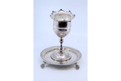 Silver poppy-shaped toothpick holder with palm-engraved base