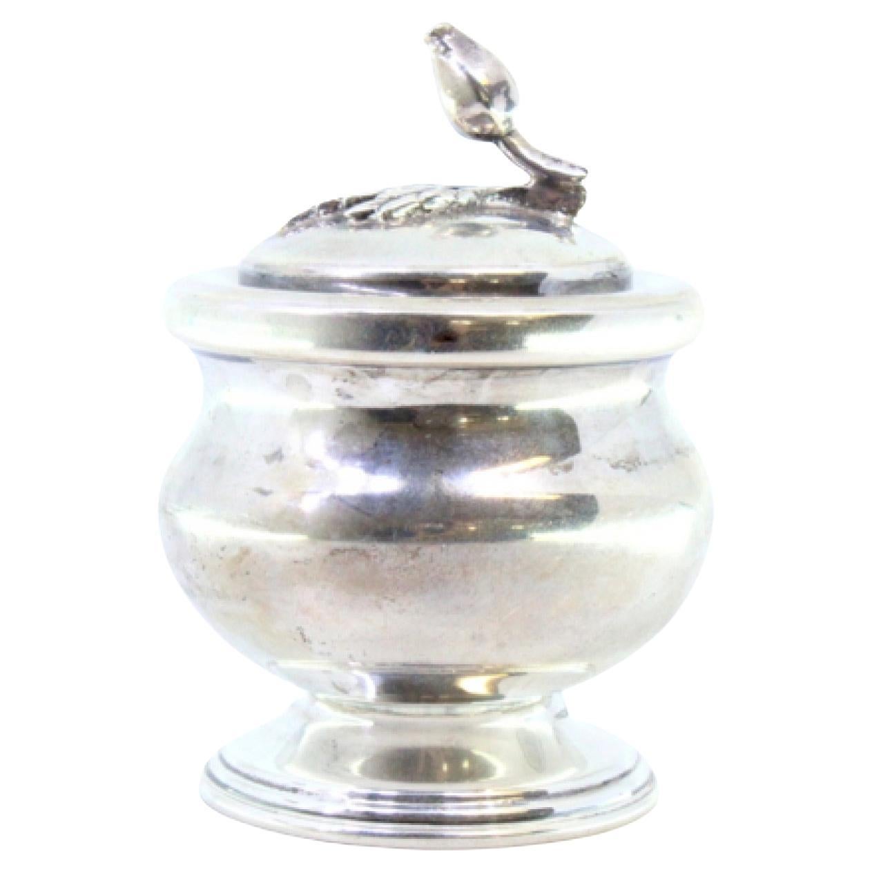 Silver pot with a base trim and a flower-shaped knob on the lid For Sale
