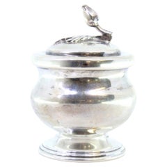 Silver pot with a base trim and a flower-shaped knob on the lid