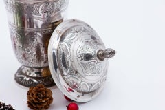 Silver pot with engraved floral motifs