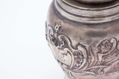 Silver pot with reliefs and filled bottom