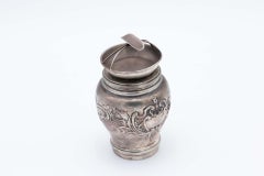 Silver pot with reliefs and filled bottom