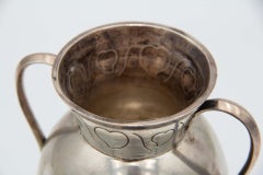 Silver pot with three support feet